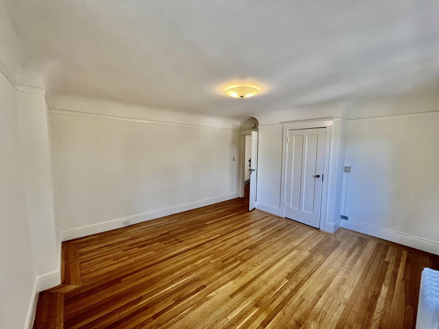1616 Adeline Drive Burlingame, CA 94010 - Photo 24 of 31 a view of an empty room with wooden floor