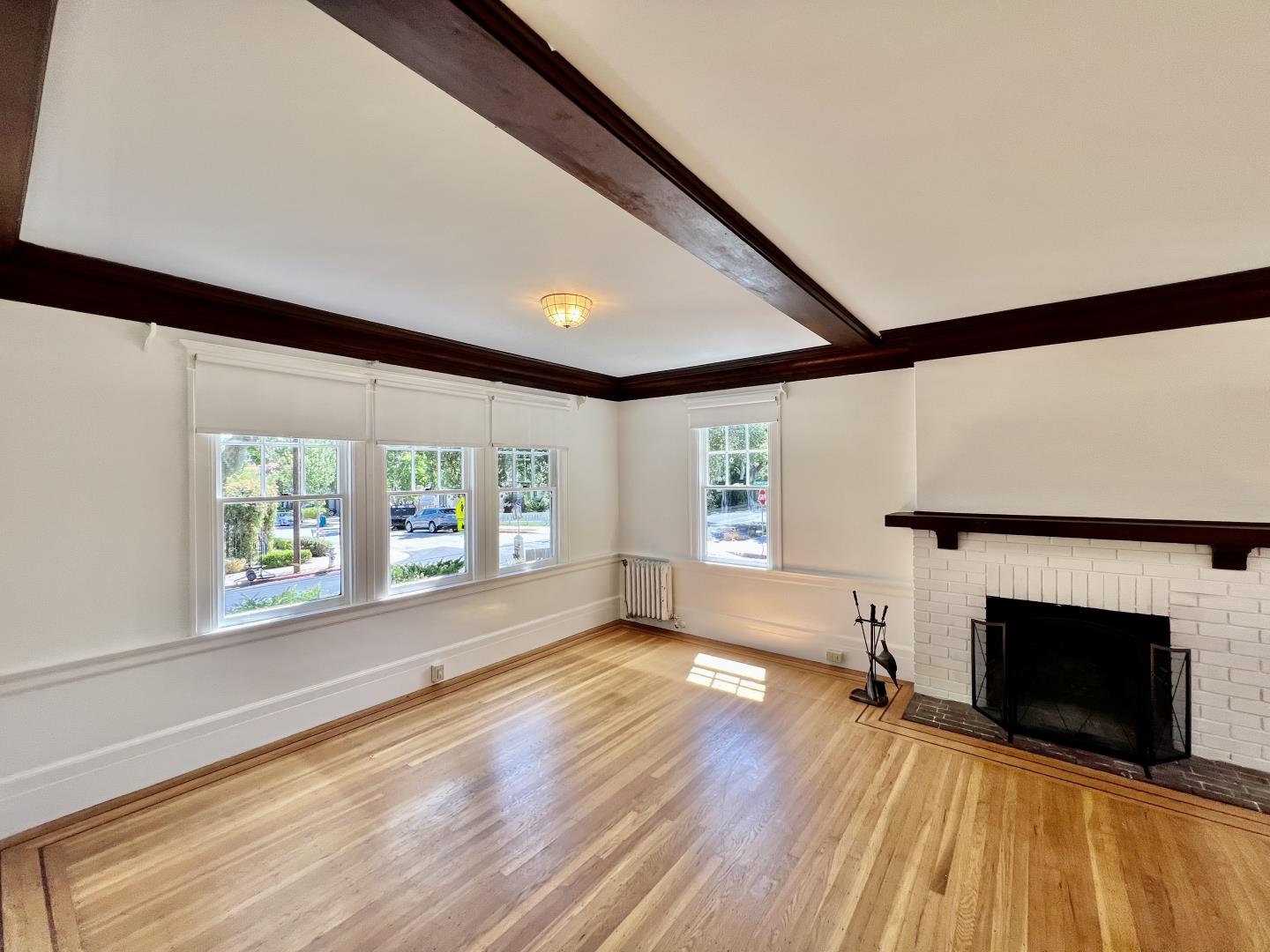 1616 Adeline Drive Burlingame, CA 94010 - Photo 25 of 31 a view of empty room with wooden floor and fireplace