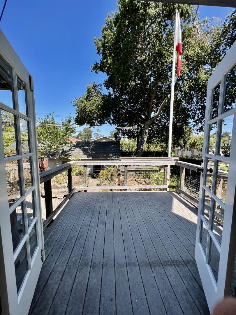 1616 Adeline Drive Burlingame, CA 94010 - Photo 30 of 31 a view of a balcony with wooden floor and iron fence