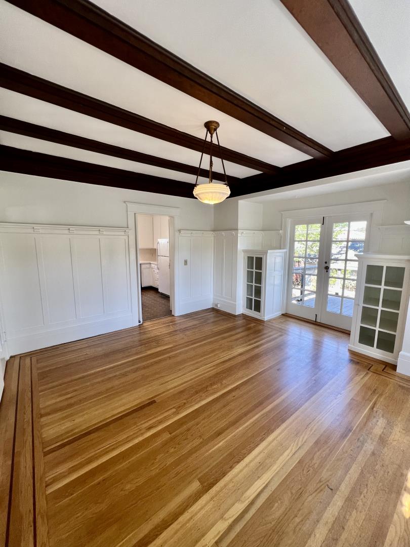 1616 Adeline Drive Burlingame, CA 94010 - Photo 6 of 31 a view of empty room with wooden floor and fireplace