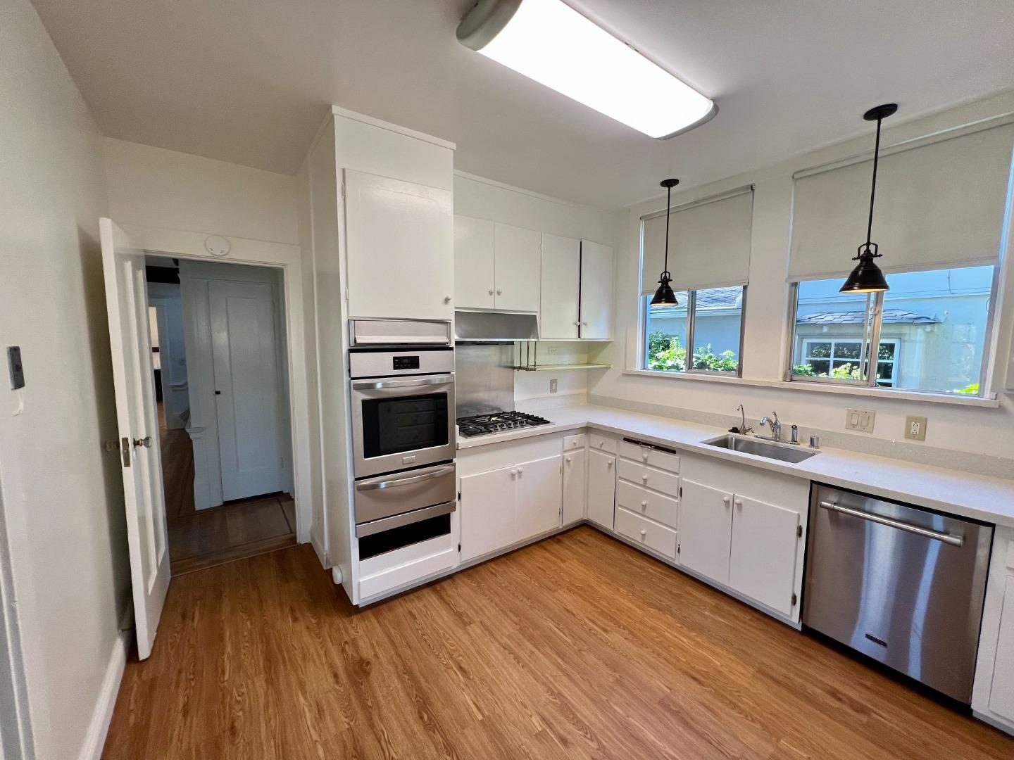 1616 Adeline Drive Burlingame, CA 94010 - Photo 9 of 31 a kitchen with stainless steel appliances granite countertop a stove a sink and a refrigerator
