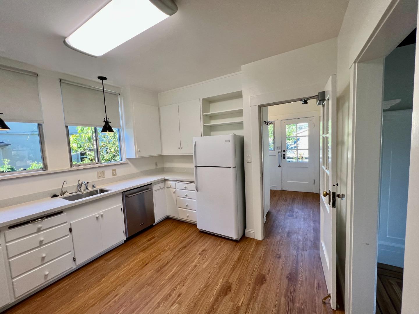 1616 Adeline Drive Burlingame, CA 94010 - Photo 10 of 31 a kitchen with a refrigerator and a sink