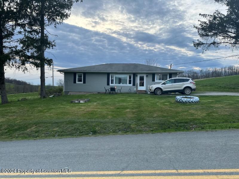 1609 State Rte 3005 Meshoppen, PA 18630 - Photo 1 of 18 front view of a house with a yard