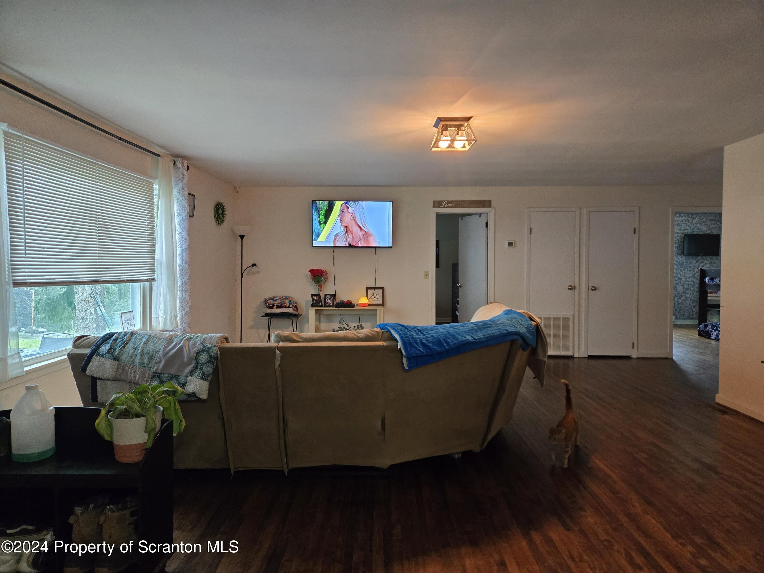 1609 State Rte 3005 Meshoppen, PA 18630 - Photo 15 of 18 a living room with furniture and a flat screen tv