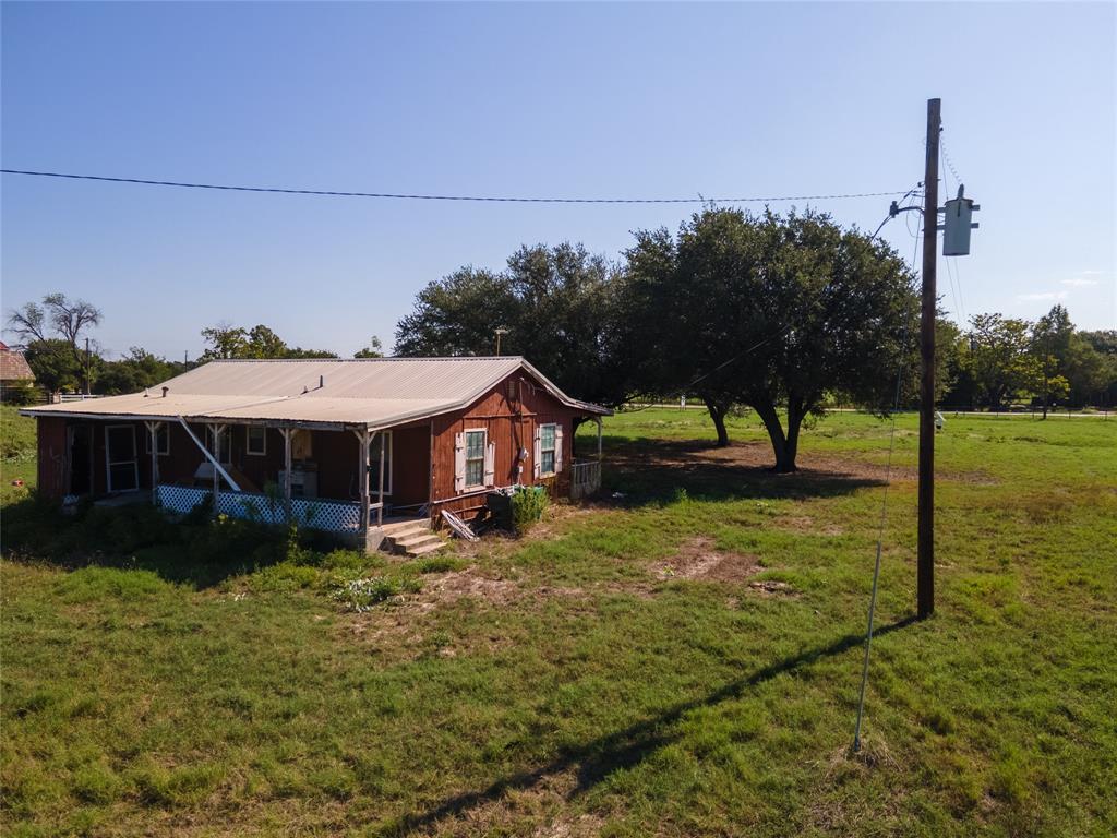 0 Old Base Road Rhome, TX 76078 - Photo 22 of 27 a view of a house with backyard and trees