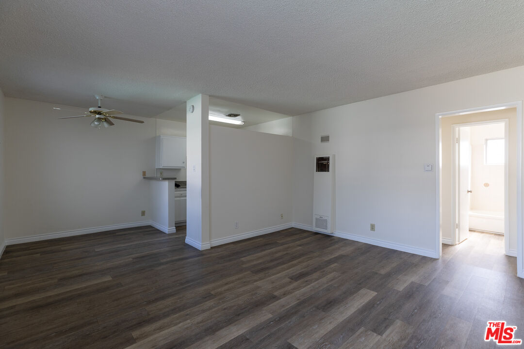 1295 Federal Avenue, Unit 8 Los Angeles, CA 90025 - Photo 1 of 12 an empty room with wooden floor