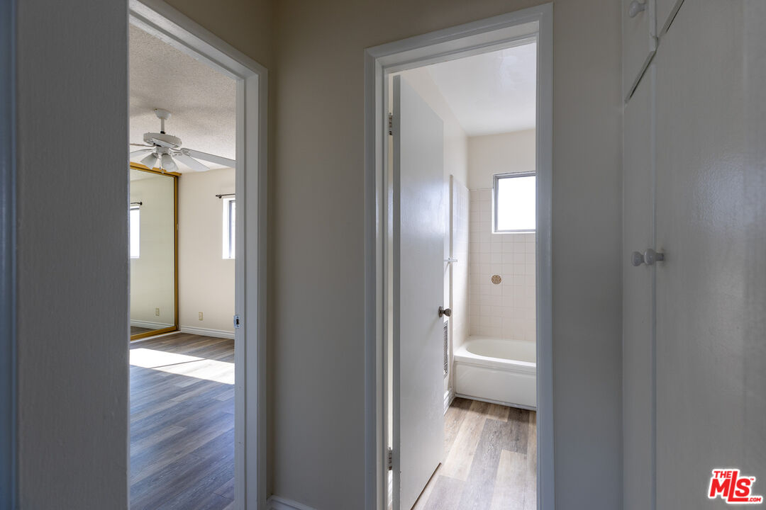 1295 Federal Avenue, Unit 8 Los Angeles, CA 90025 - Photo 9 of 12 a view of a bathroom with a toilet sink and a wooden floor