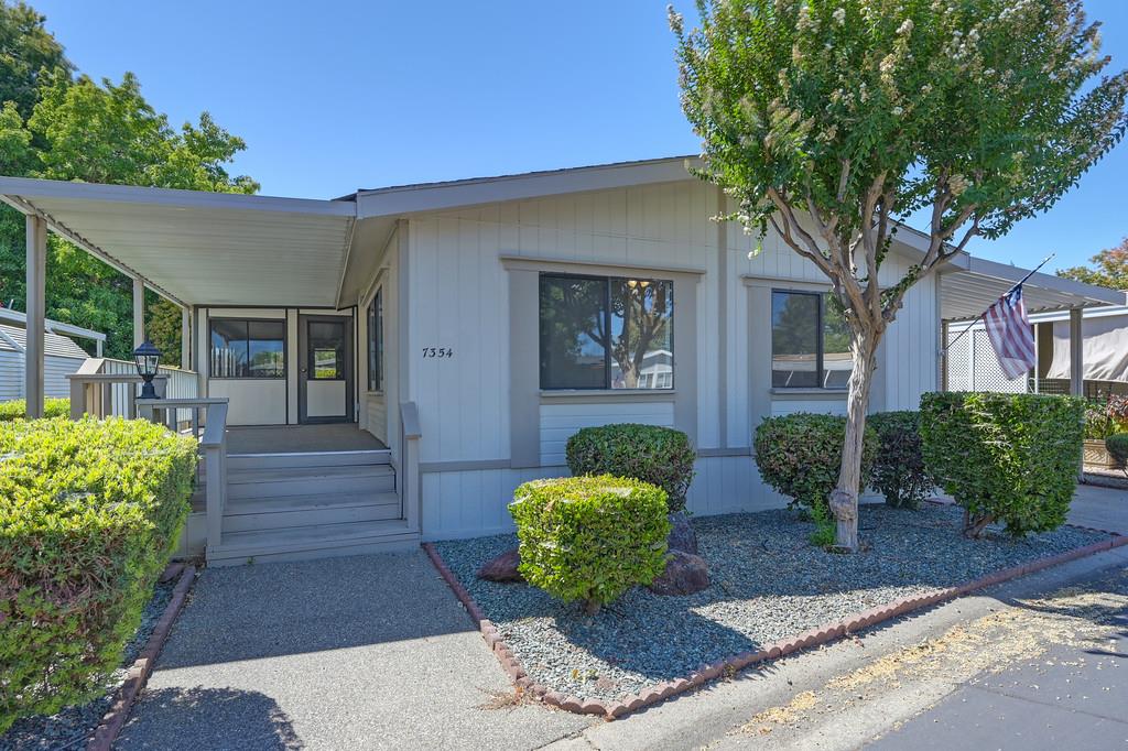 a front view of a house with garden