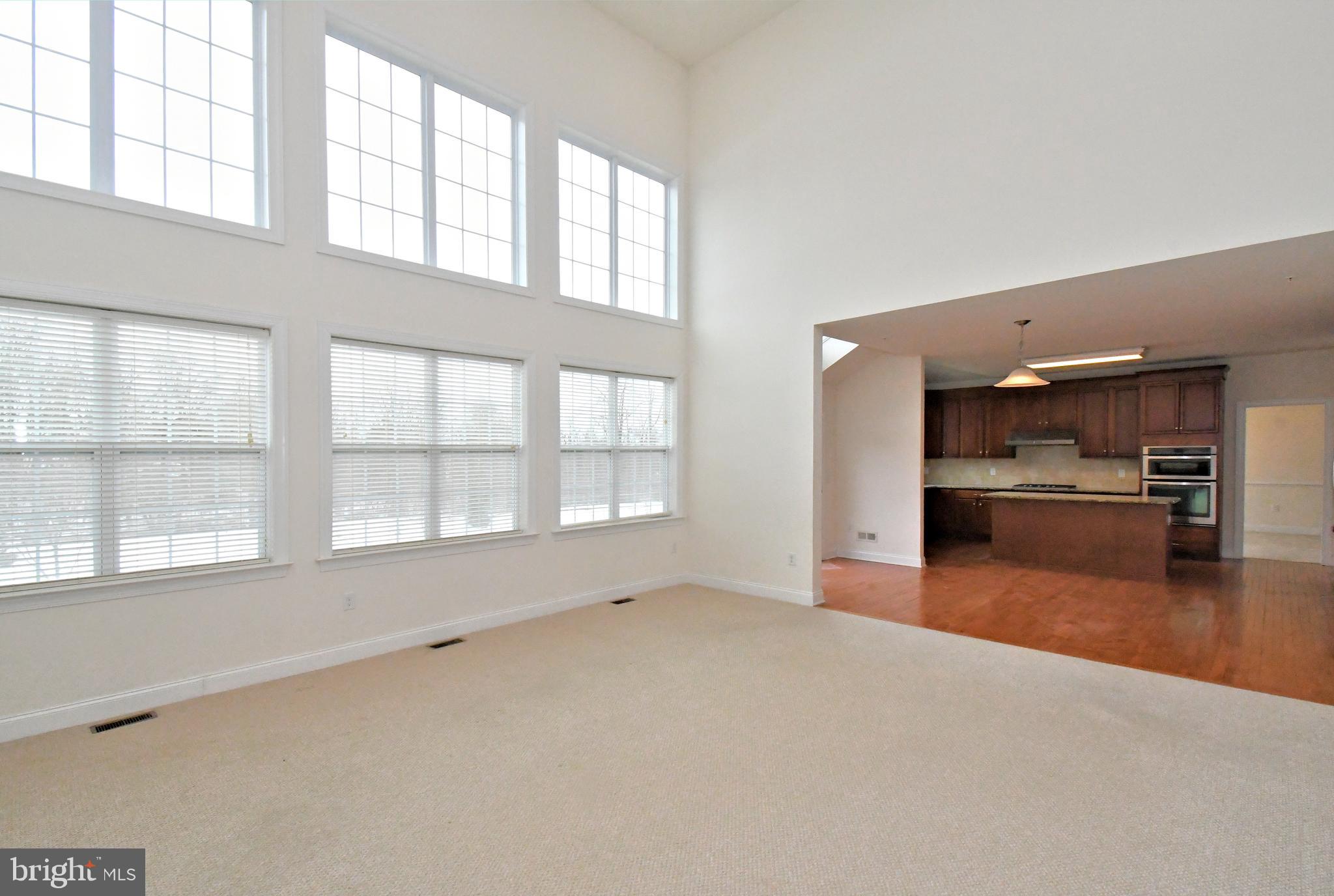 2804 Hoffs Way Warrington, PA 18976 - Photo 21 of 63 an empty room with a kitchen and windows