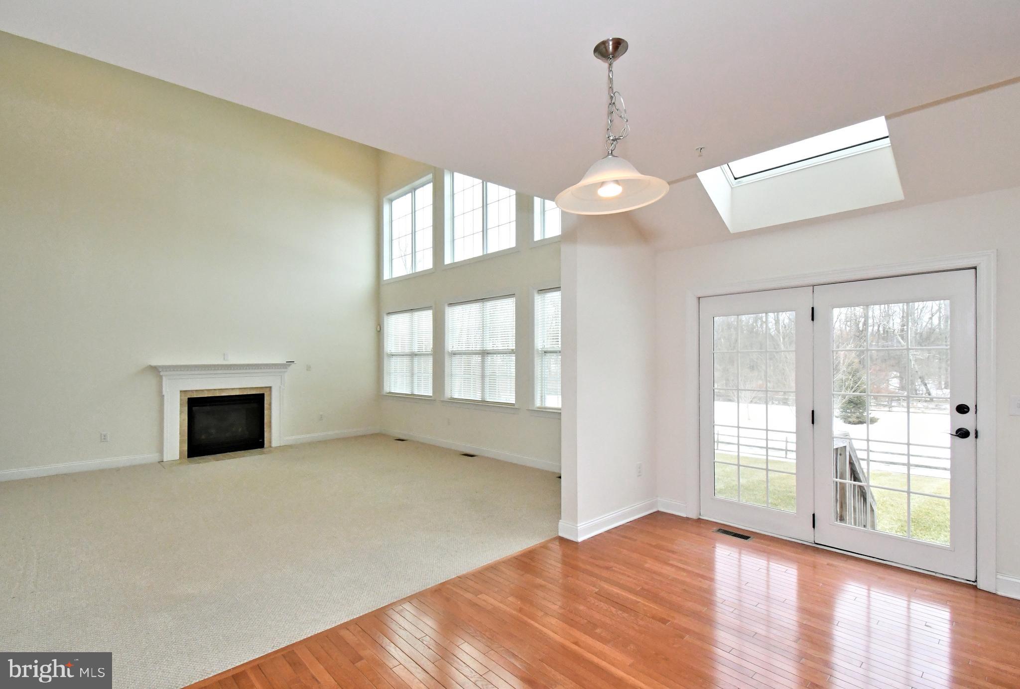 2804 Hoffs Way Warrington, PA 18976 - Photo 25 of 63 a view of an empty room with wooden floor and a window