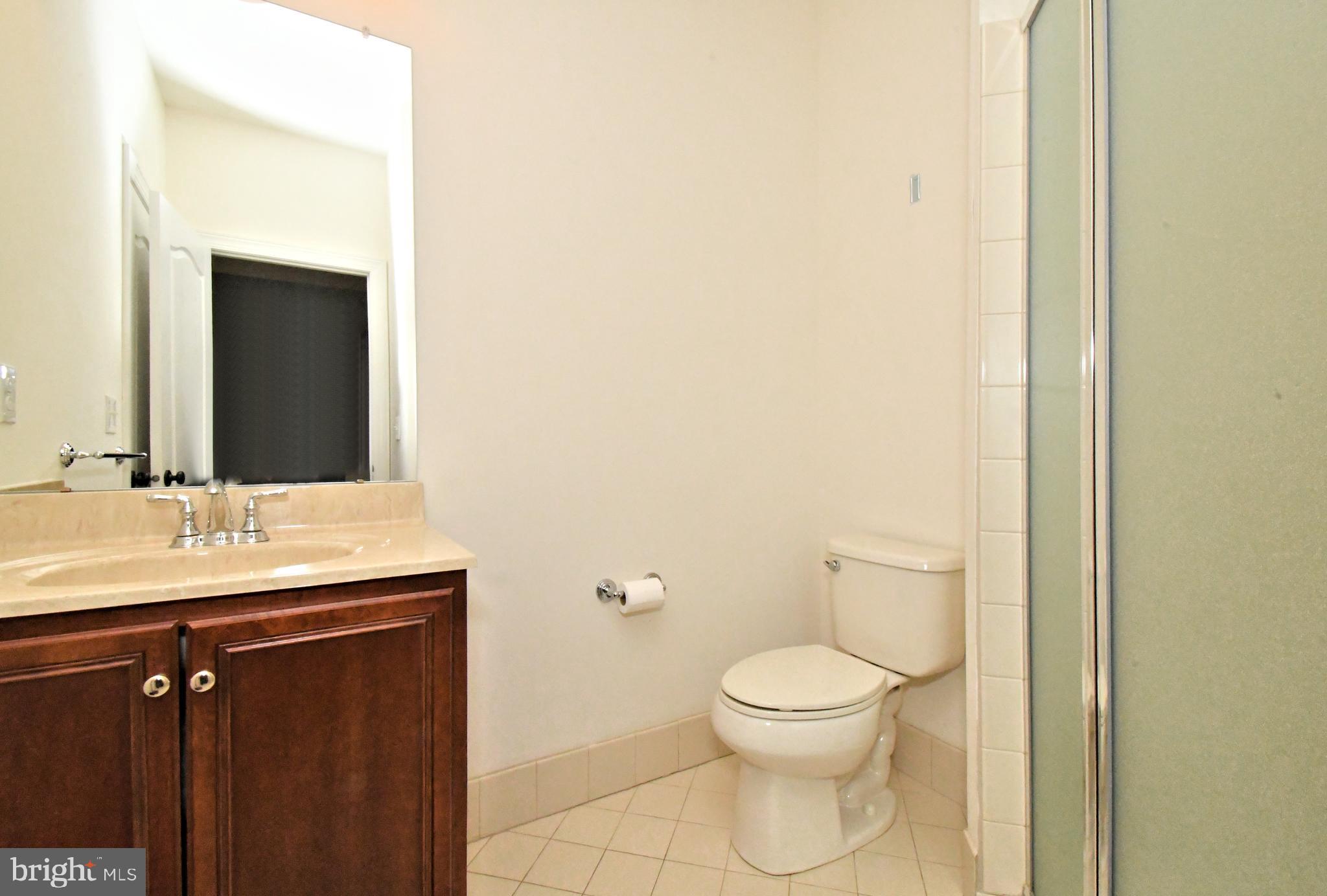 2804 Hoffs Way Warrington, PA 18976 - Photo 27 of 63 a bathroom with a toilet a sink and mirror