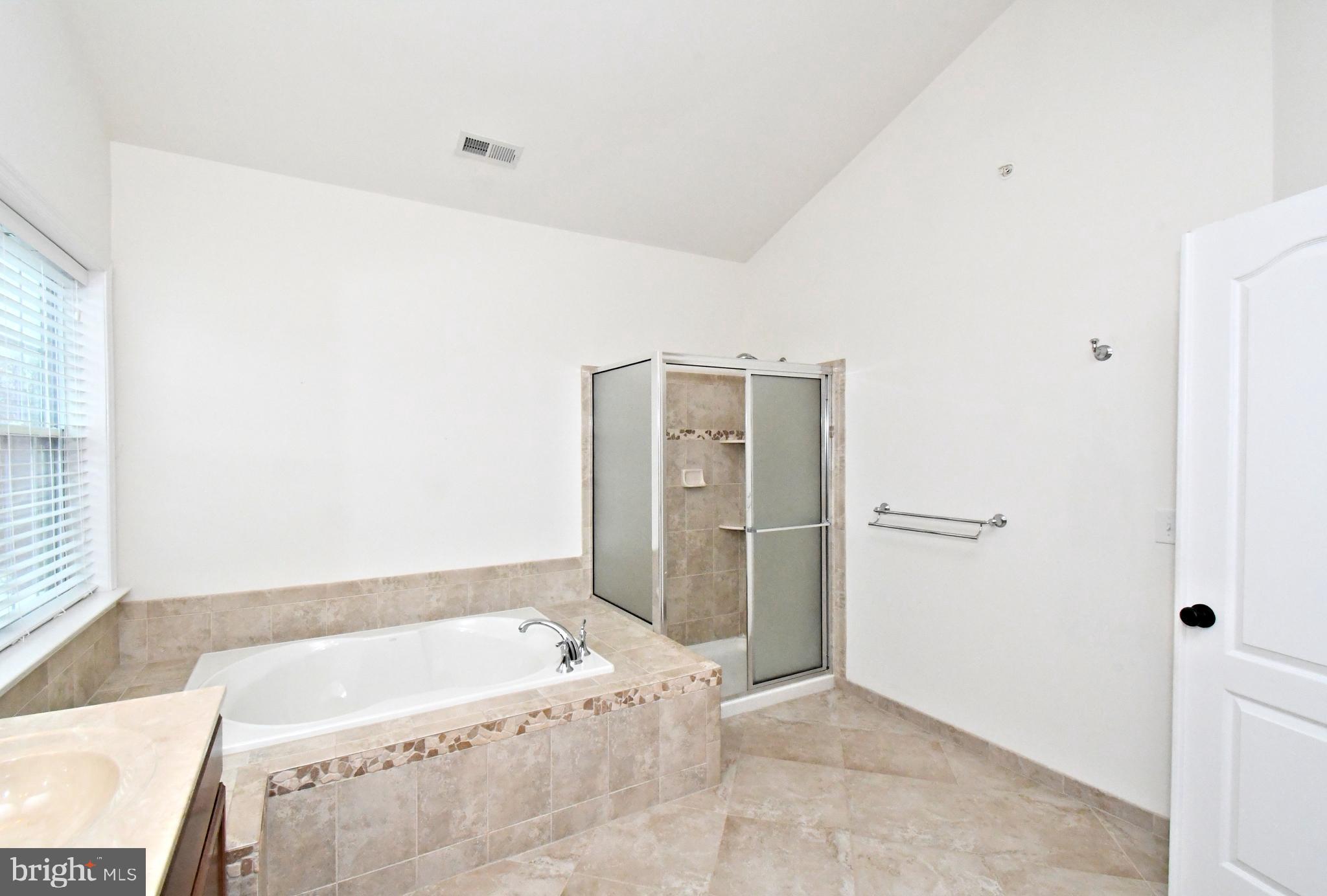 2804 Hoffs Way Warrington, PA 18976 - Photo 35 of 63 a bathroom with a bathtub and shower