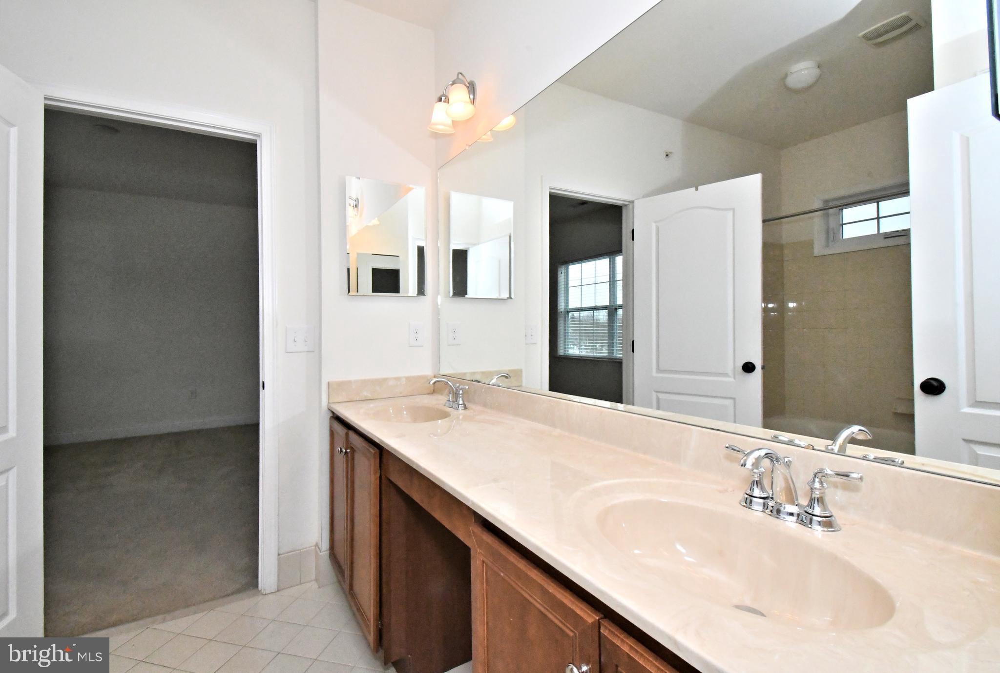 2804 Hoffs Way Warrington, PA 18976 - Photo 43 of 63 a bathroom with a sink and a mirror