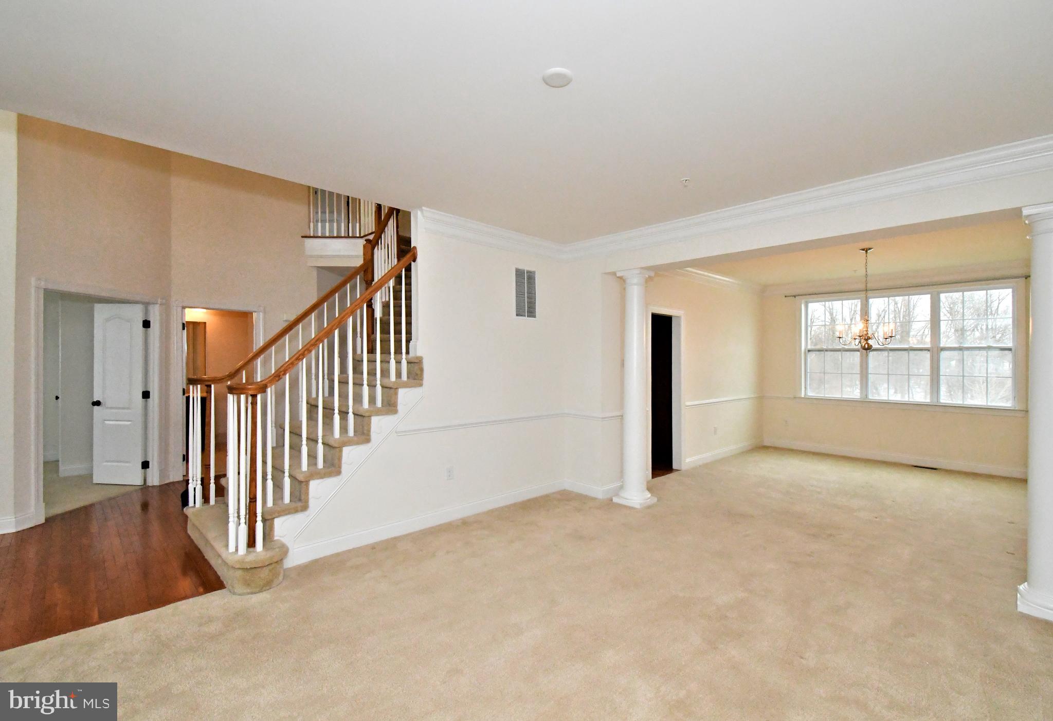 2804 Hoffs Way Warrington, PA 18976 - Photo 7 of 63 a view of an empty room with wooden floor and a window