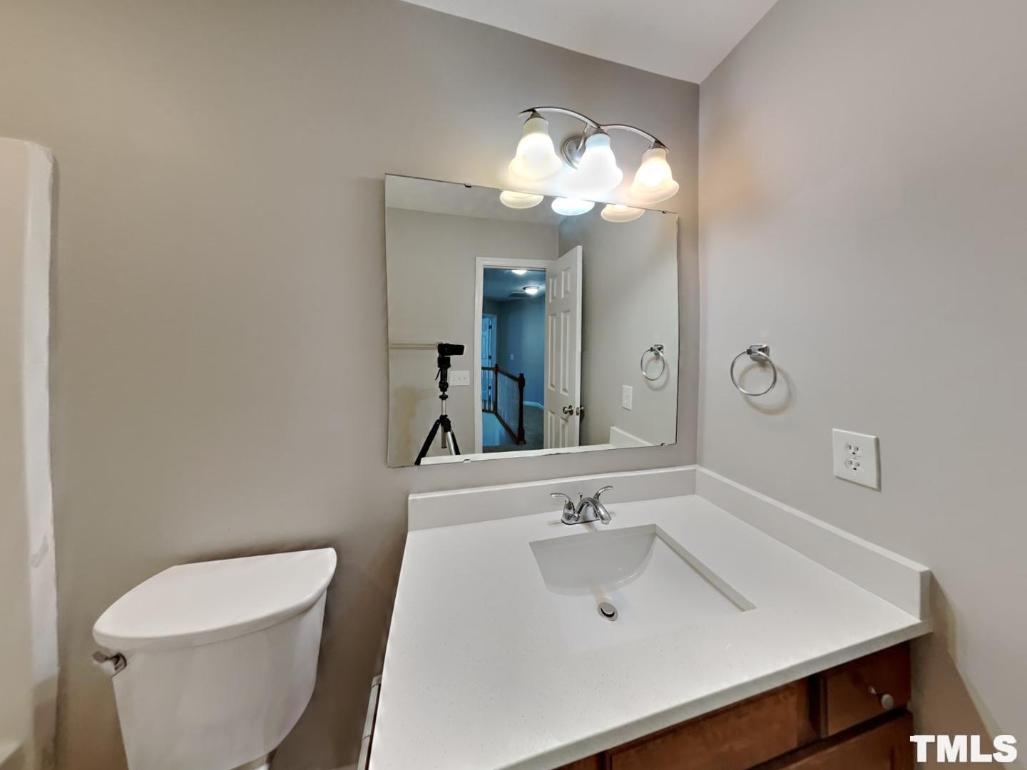 200 Lattimore Road Cameron, NC 28326 - Photo 16 of 19 a bathroom with a sink a toilet and a mirror