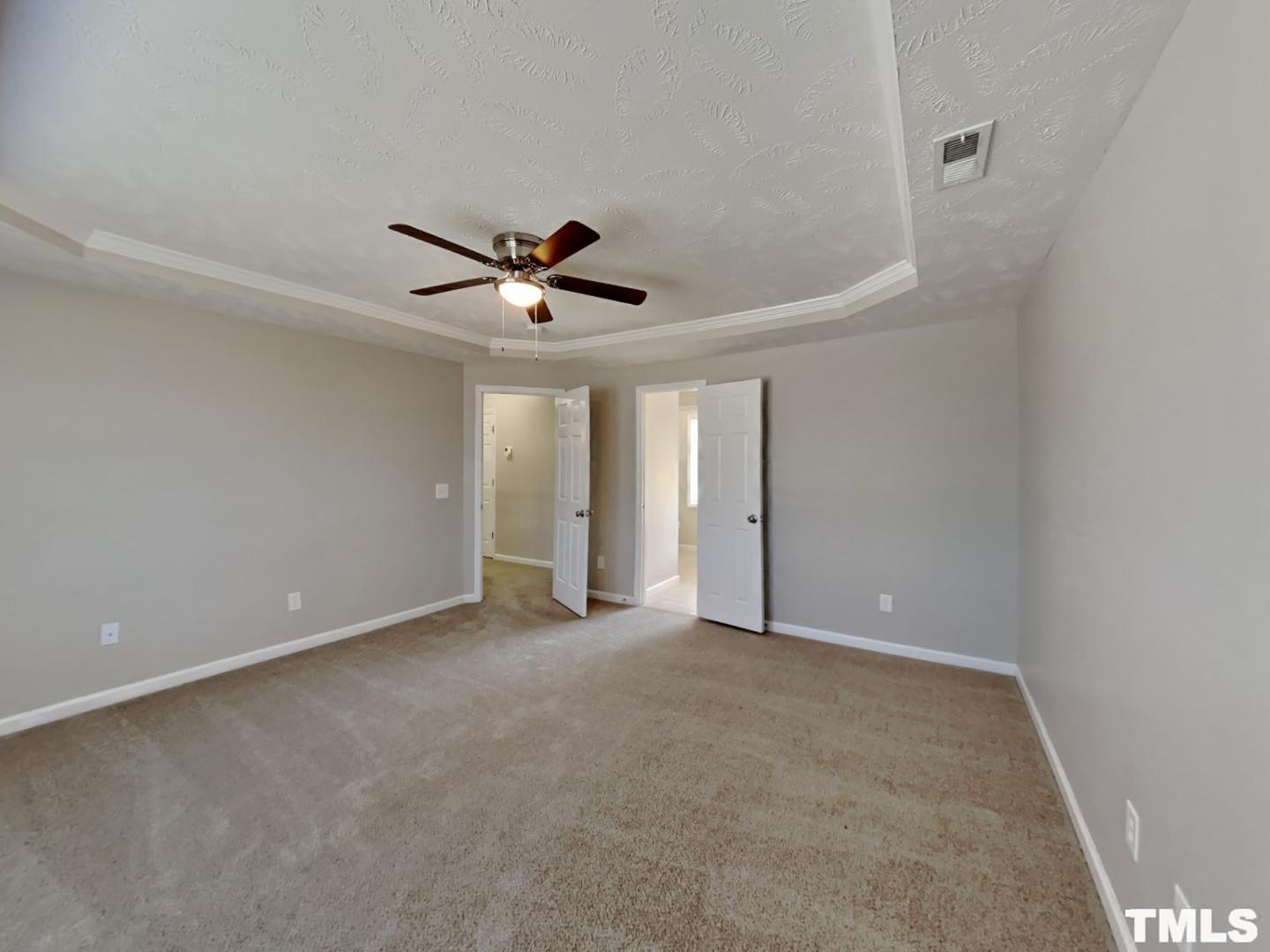 200 Lattimore Road Cameron, NC 28326 - Photo 8 of 19 a view of an empty room with a ceiling fan