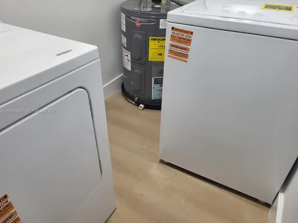 a utility room with dryer and washer