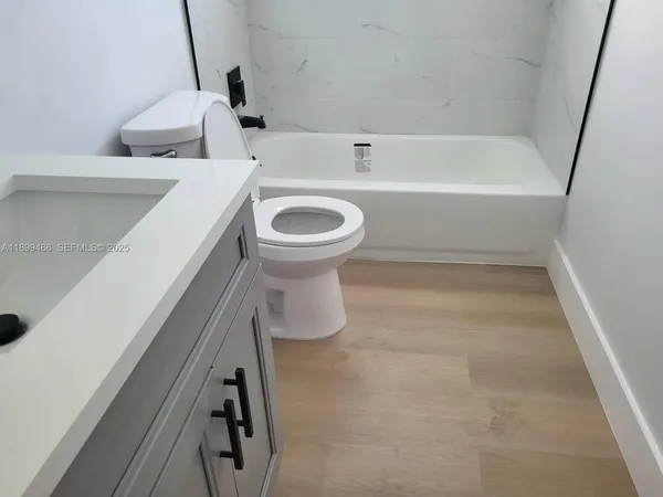 a bathroom with a sink and a bathtub