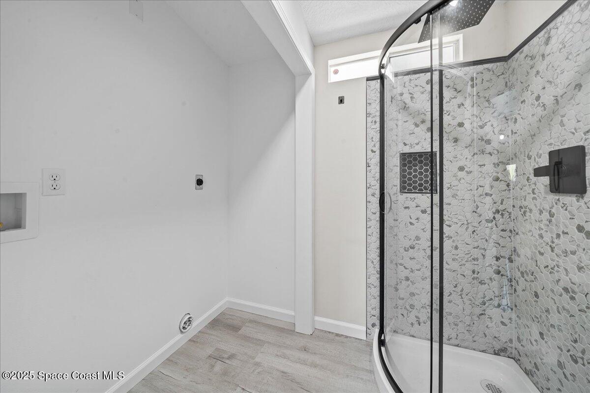 1924 Big Cypress Street Northeast Palm Bay, FL 32905 - Photo 25 of 29 a bathroom with a shower