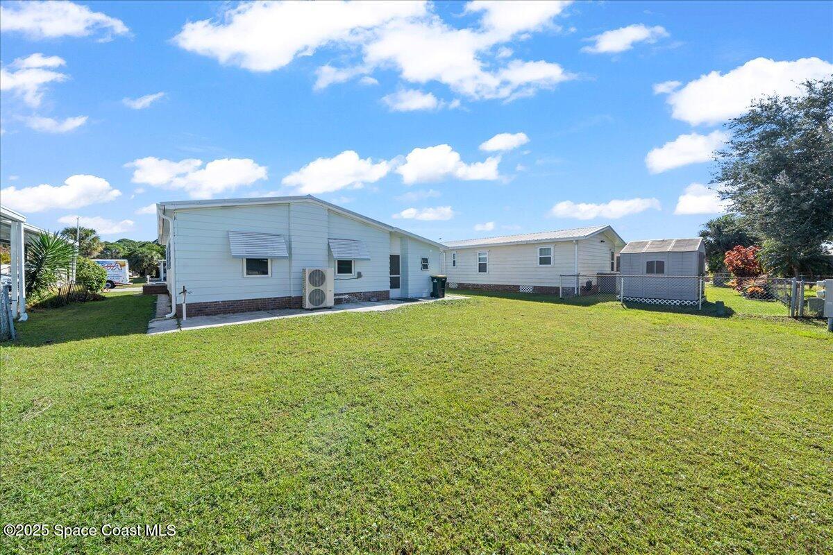 1924 Big Cypress Street Northeast Palm Bay, FL 32905 - Photo 28 of 29 a view of a backyard of the house