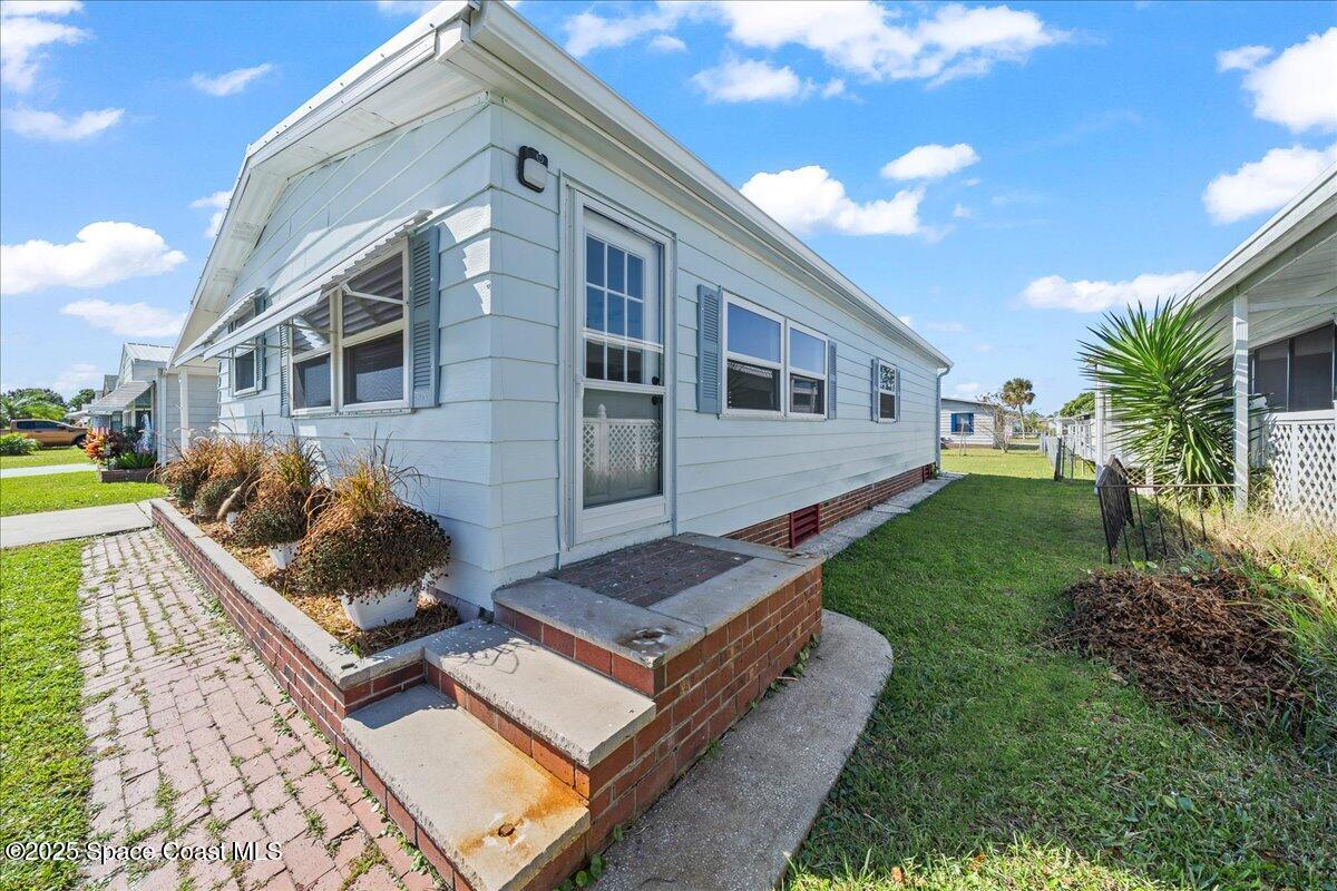 1924 Big Cypress Street Northeast Palm Bay, FL 32905 - Photo 4 of 29 a view of house with backyard