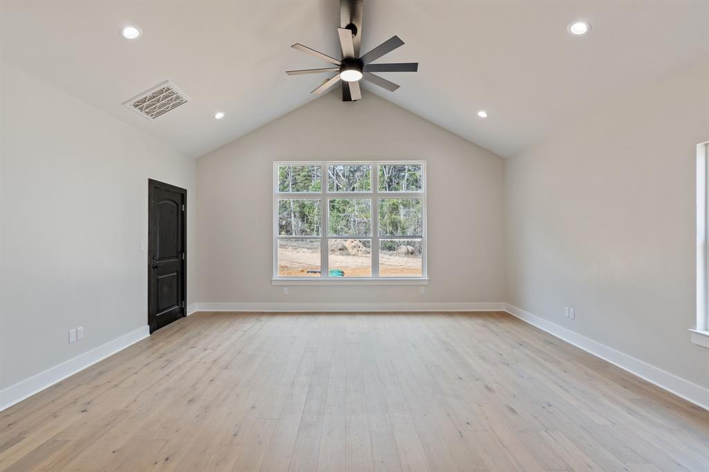 335 Perdanales Bullard, TX 75757 - Photo 19 of 37 wooden floor in an empty room with a window
