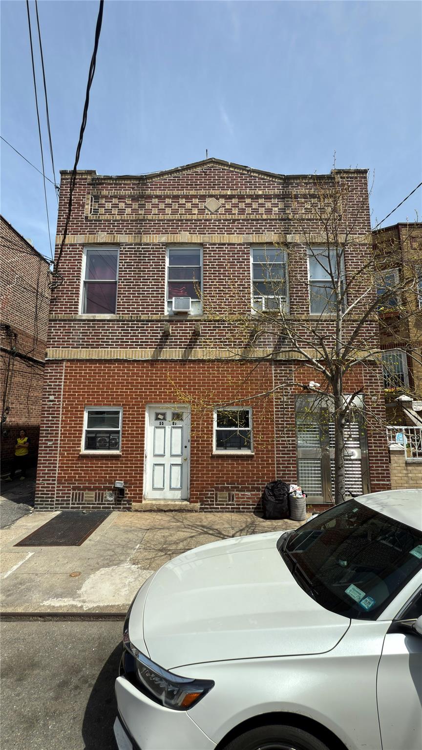 55-07 103rd Street Queens, NY 11368 - Photo 9 of 10 View of front of home featuring brick siding and cooling unit