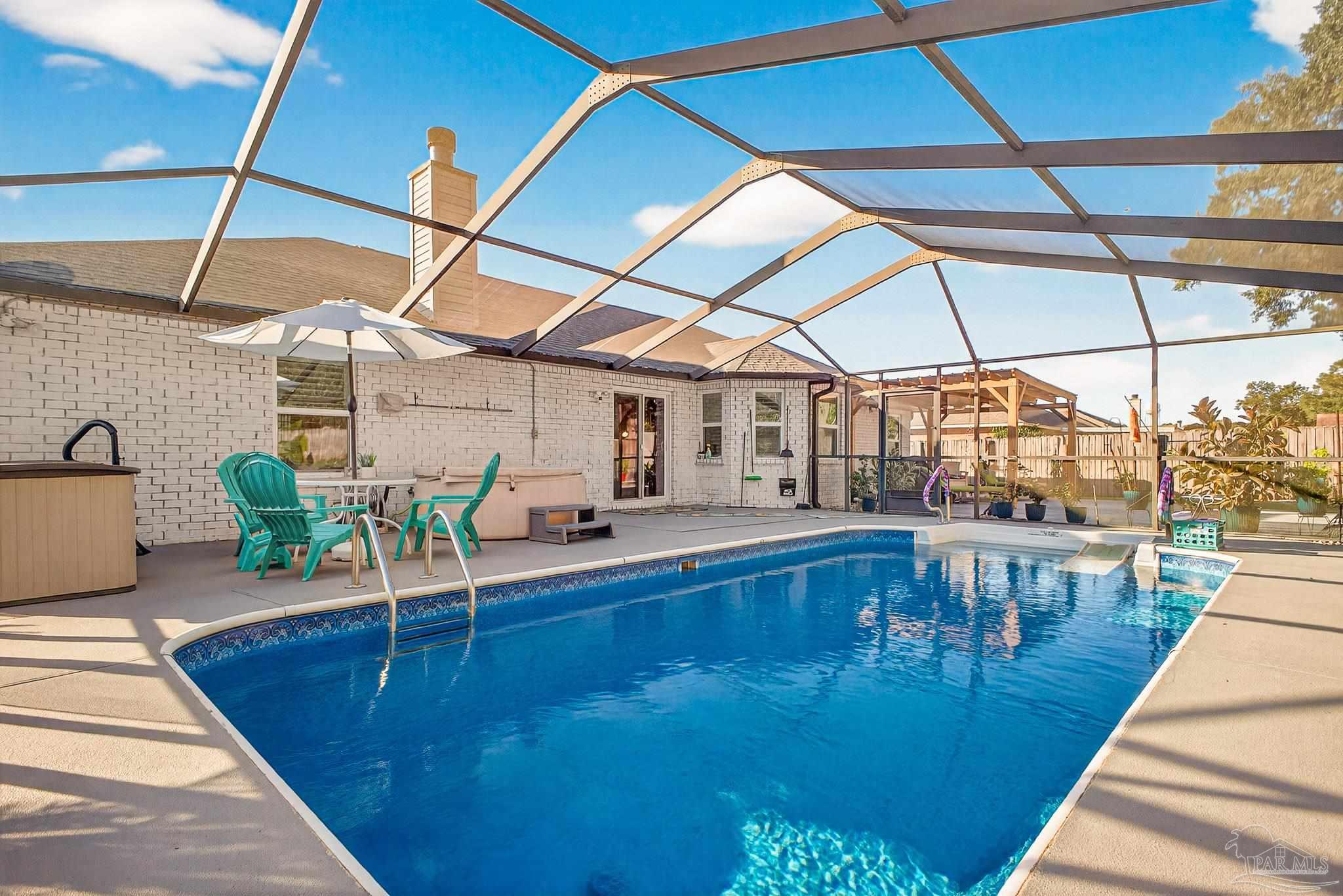 a view of a patio with a table and chairs