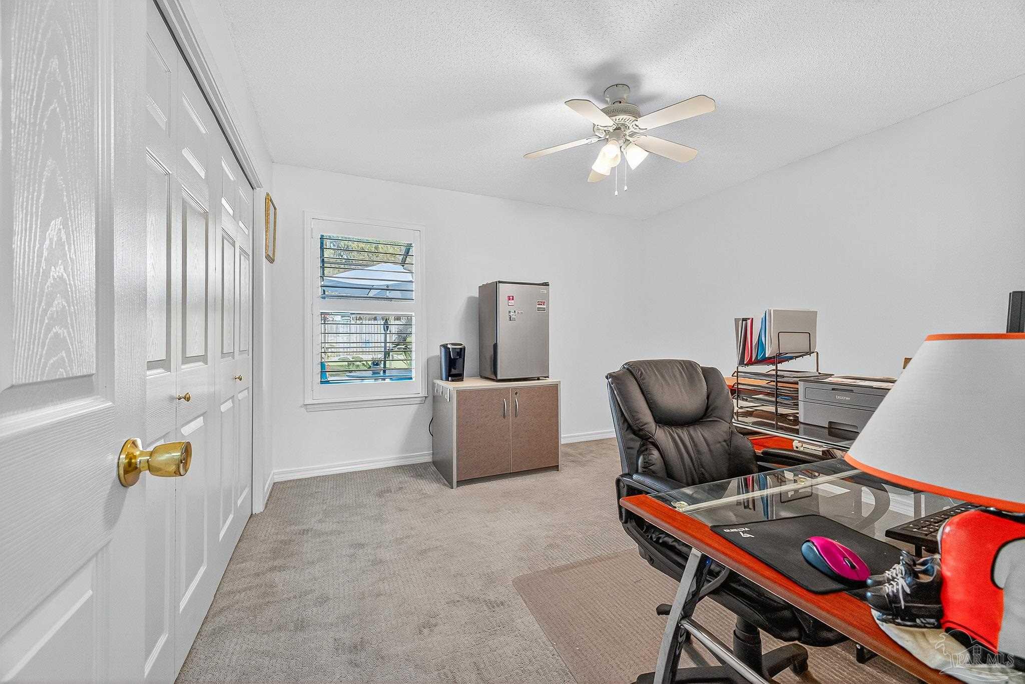 4650 Ridge Pointe Drive Pace, FL 32571 - Photo 13 of 38 a living room with furniture and a window