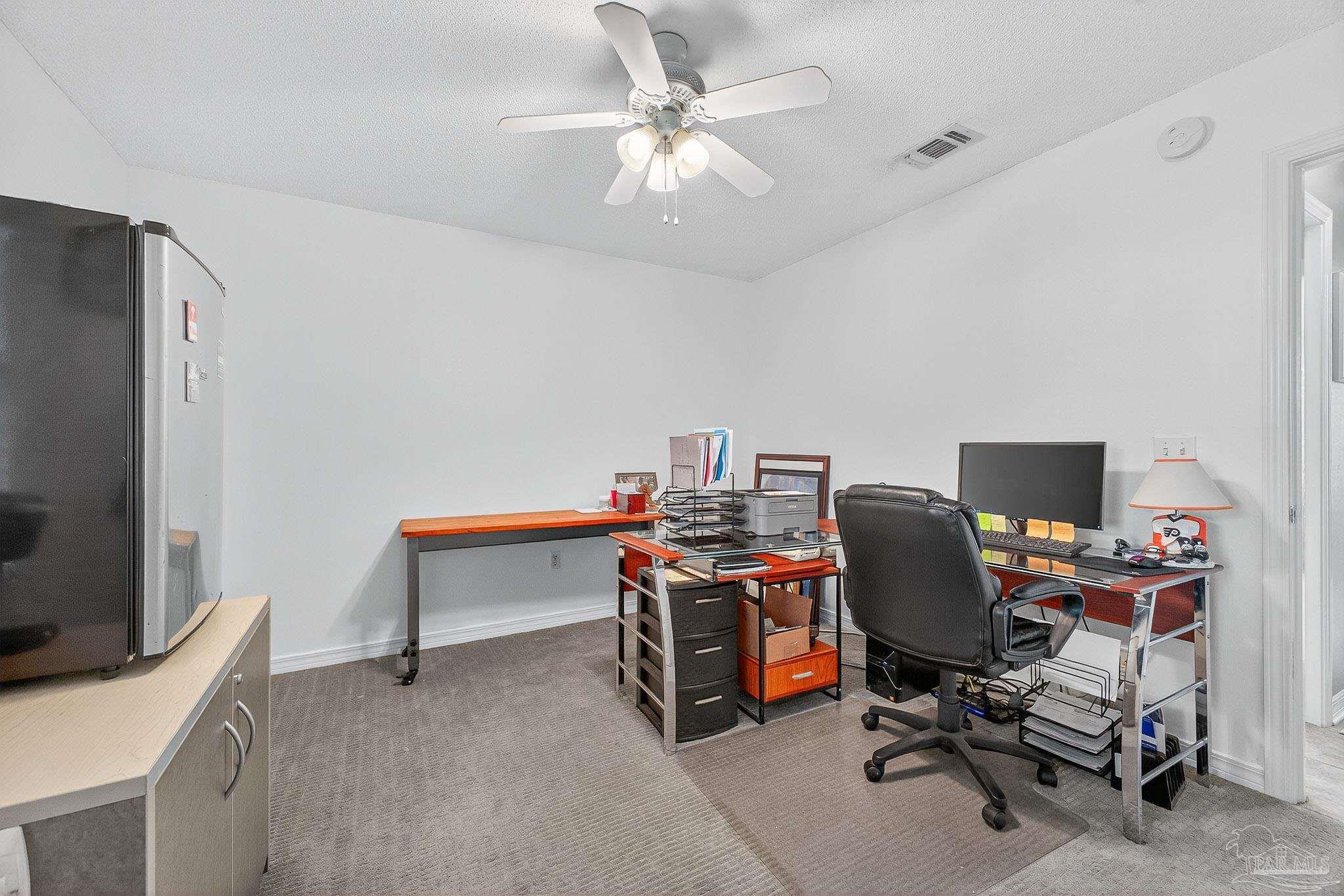 4650 Ridge Pointe Drive Pace, FL 32571 - Photo 14 of 38 a view of a workspace with furniture and a workspace