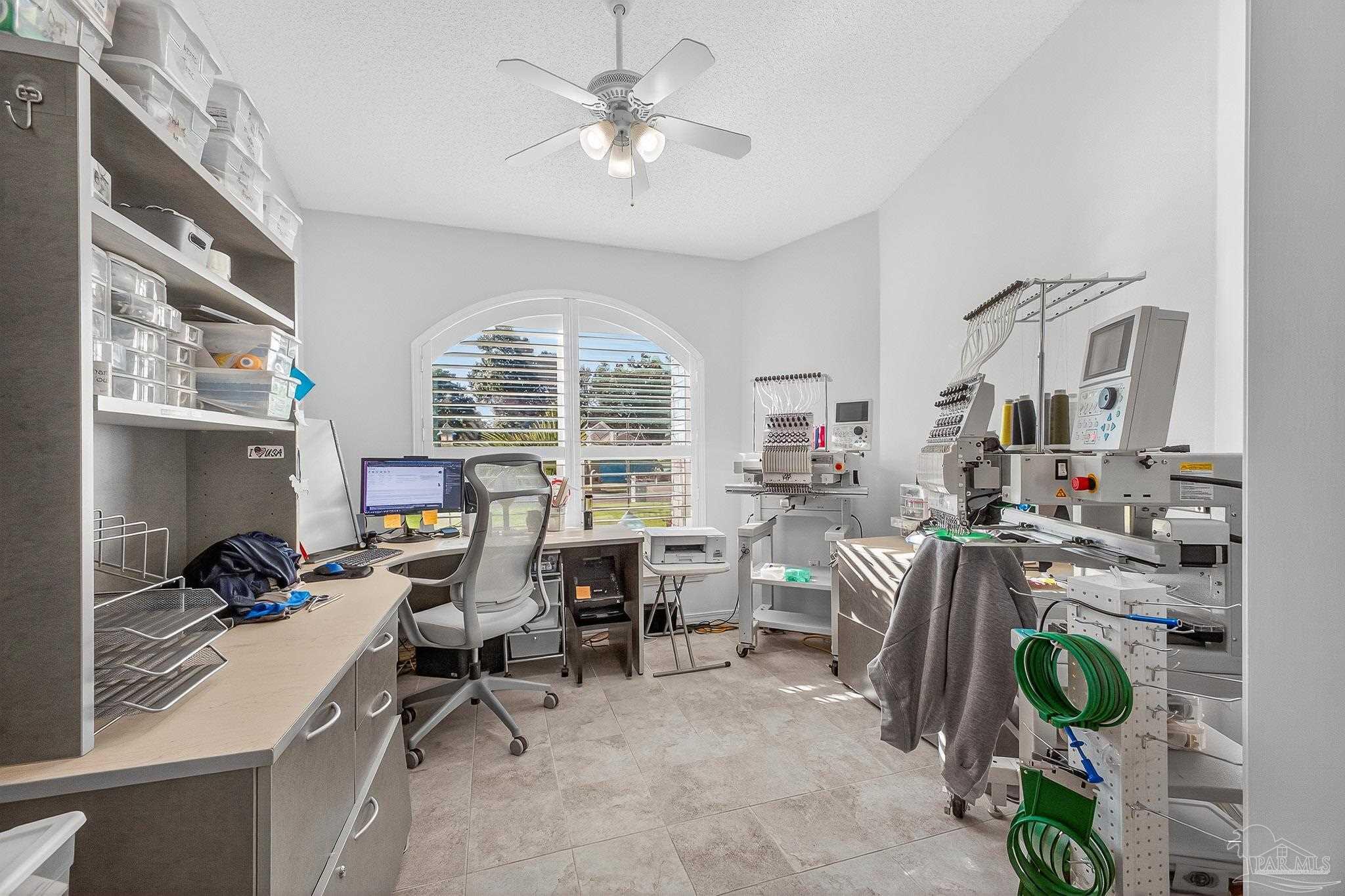 4650 Ridge Pointe Drive Pace, FL 32571 - Photo 15 of 38 a view of a workspace with furniture and a window