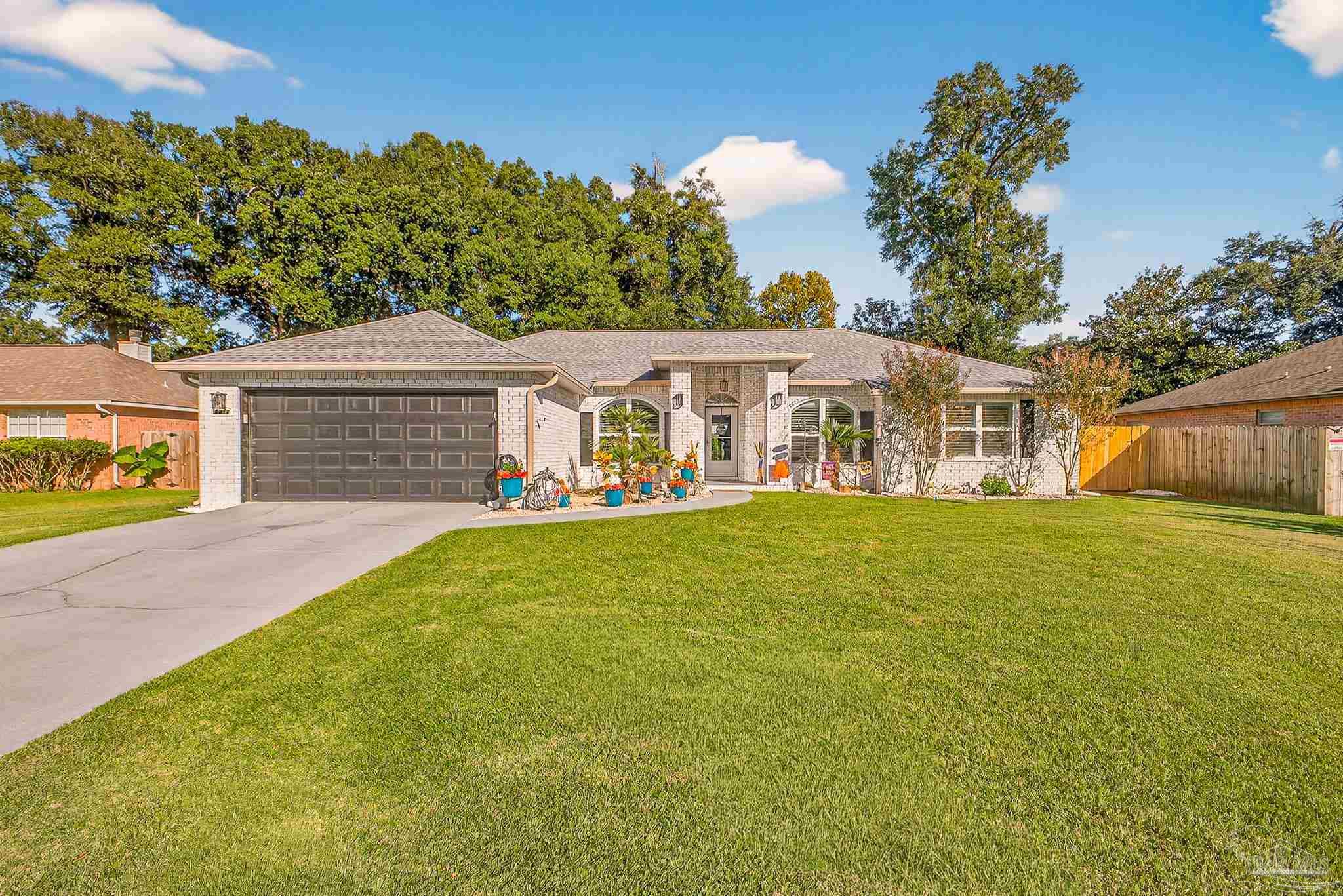 4650 Ridge Pointe Drive Pace, FL 32571 - Photo 2 of 38 a view of a house with a backyard
