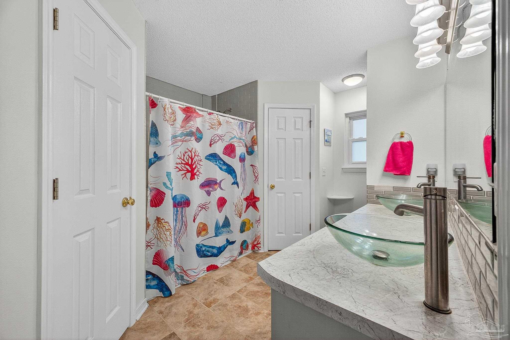4650 Ridge Pointe Drive Pace, FL 32571 - Photo 26 of 38 a bathroom with a sink vanity granite and toilet