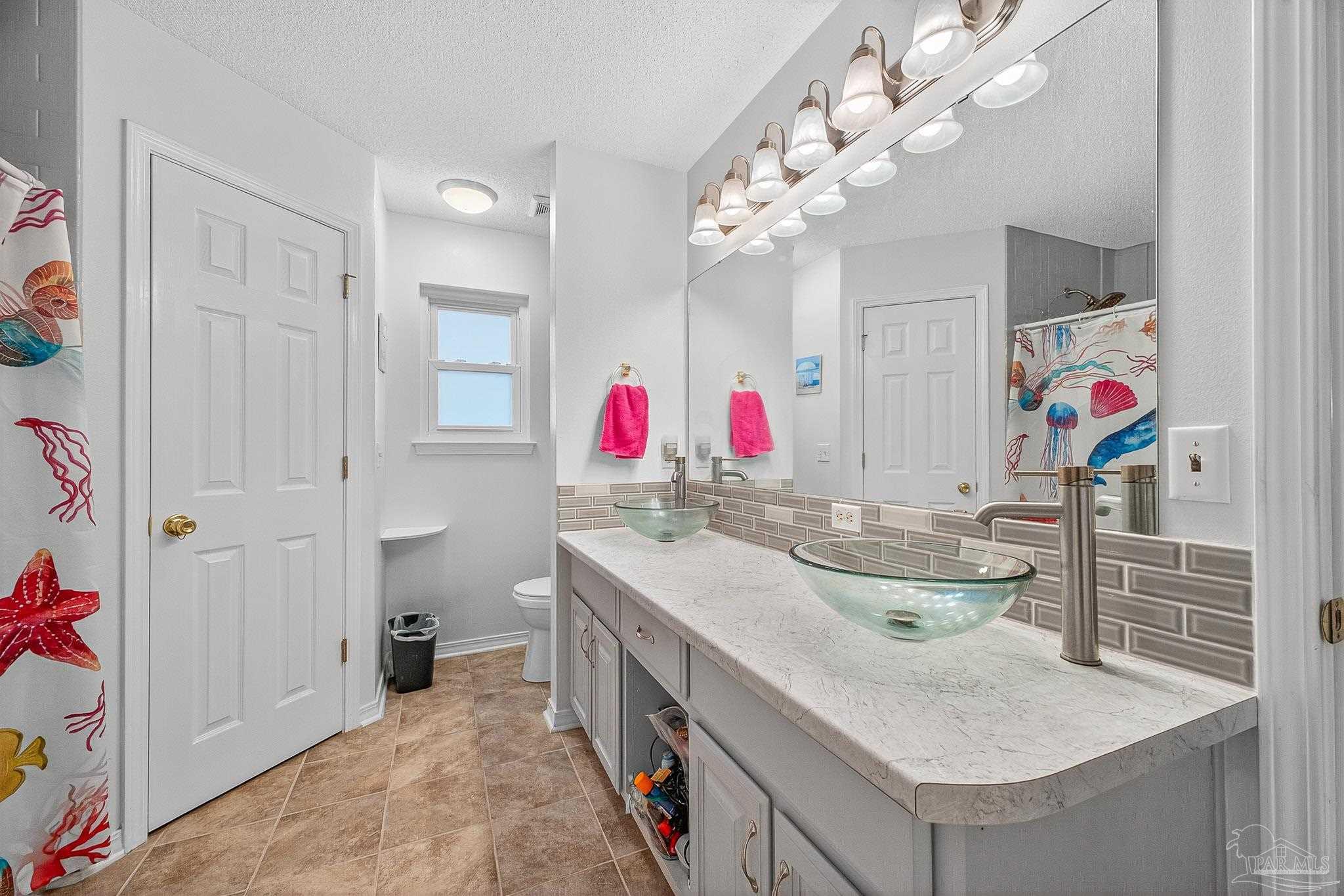 4650 Ridge Pointe Drive Pace, FL 32571 - Photo 27 of 38 a very nice looking dining room with a table and chairs in it