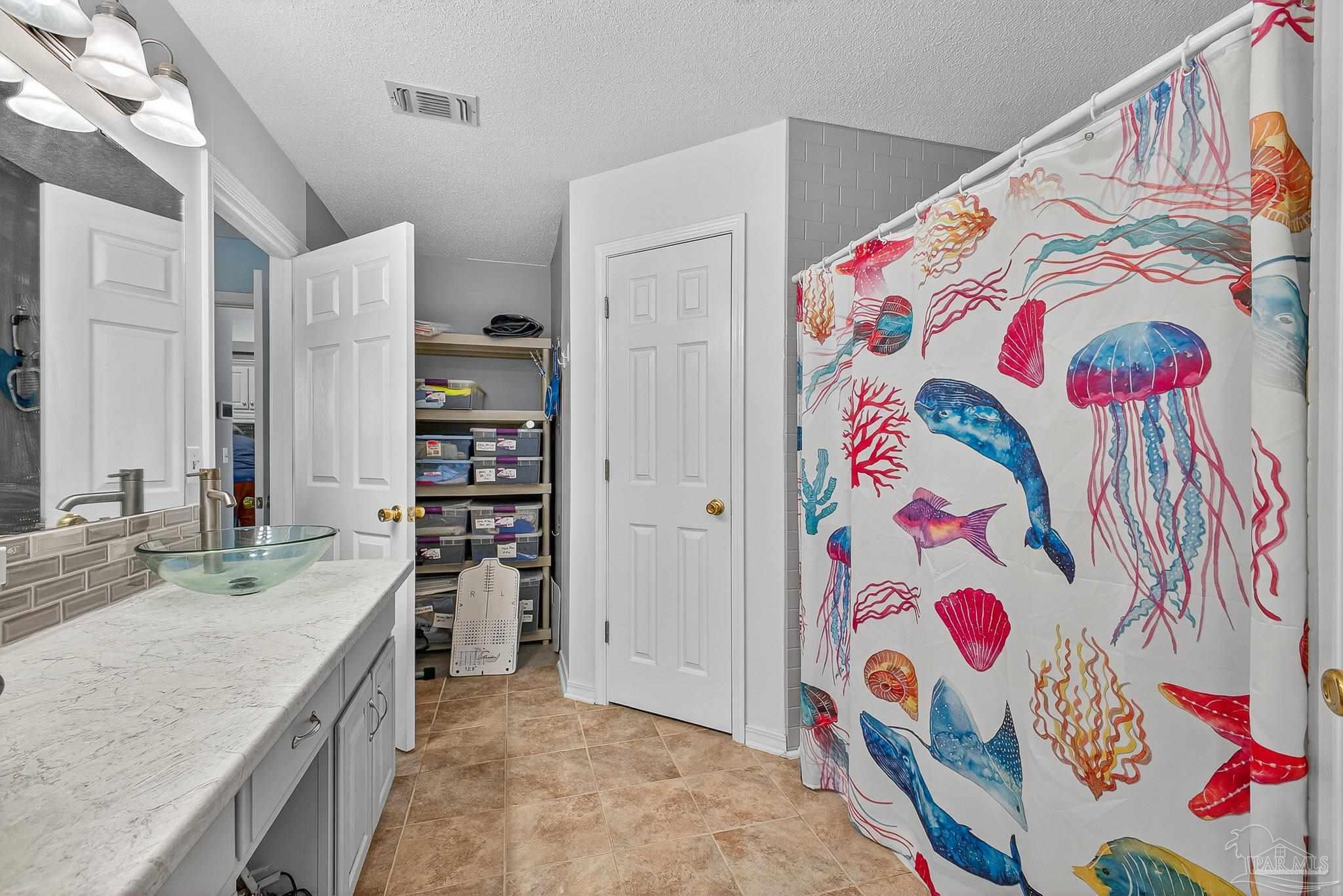 4650 Ridge Pointe Drive Pace, FL 32571 - Photo 28 of 38 a bathroom with a sink and a bathtub