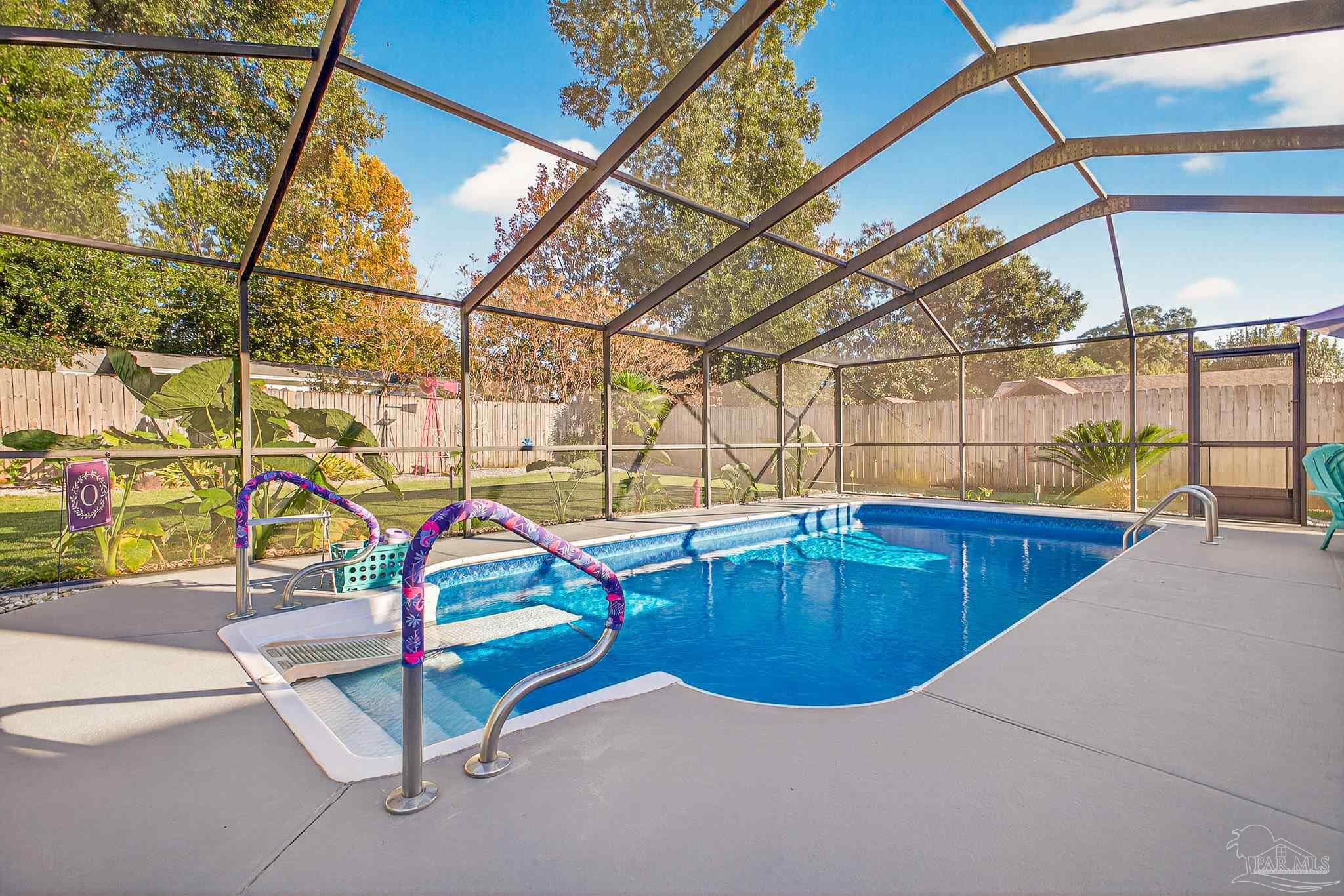 4650 Ridge Pointe Drive Pace, FL 32571 - Photo 29 of 38 a room with air hockey table and potted plants