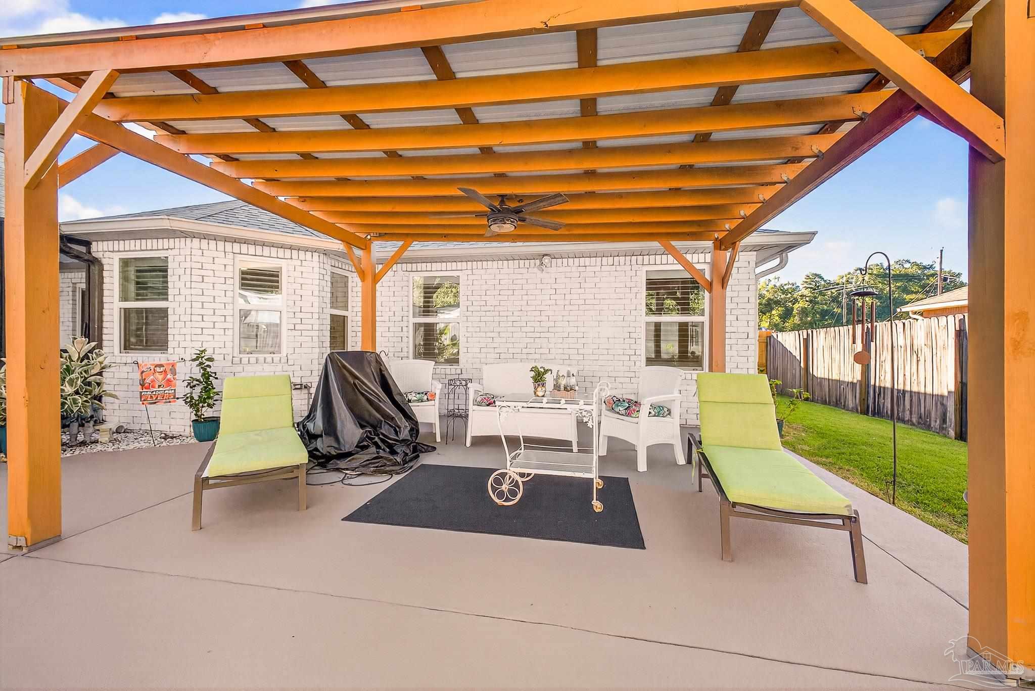 4650 Ridge Pointe Drive Pace, FL 32571 - Photo 32 of 38 a building outdoor space with patio furniture and garden