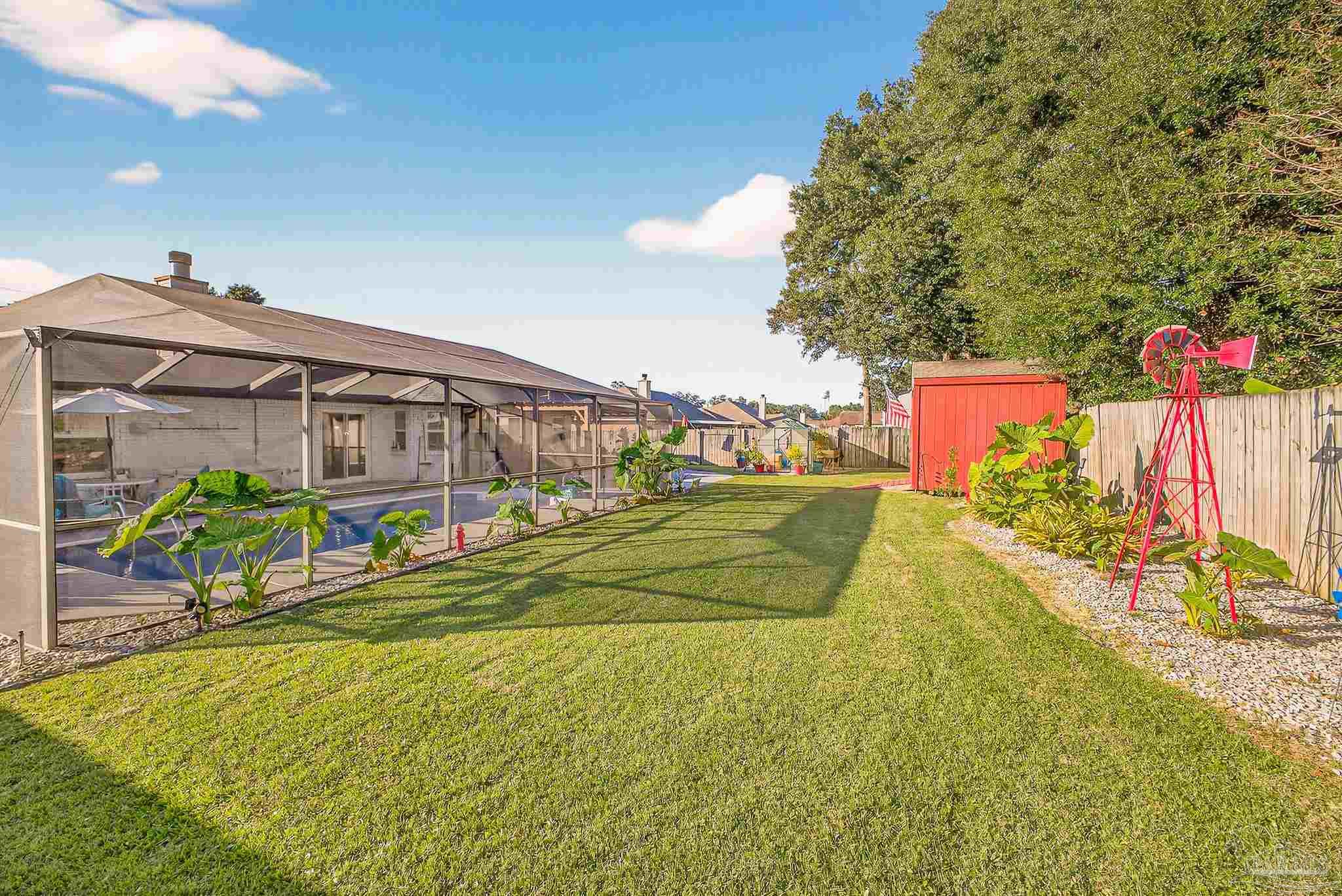 4650 Ridge Pointe Drive Pace, FL 32571 - Photo 38 of 38 a view of swimming pool with an outdoor space and seating area
