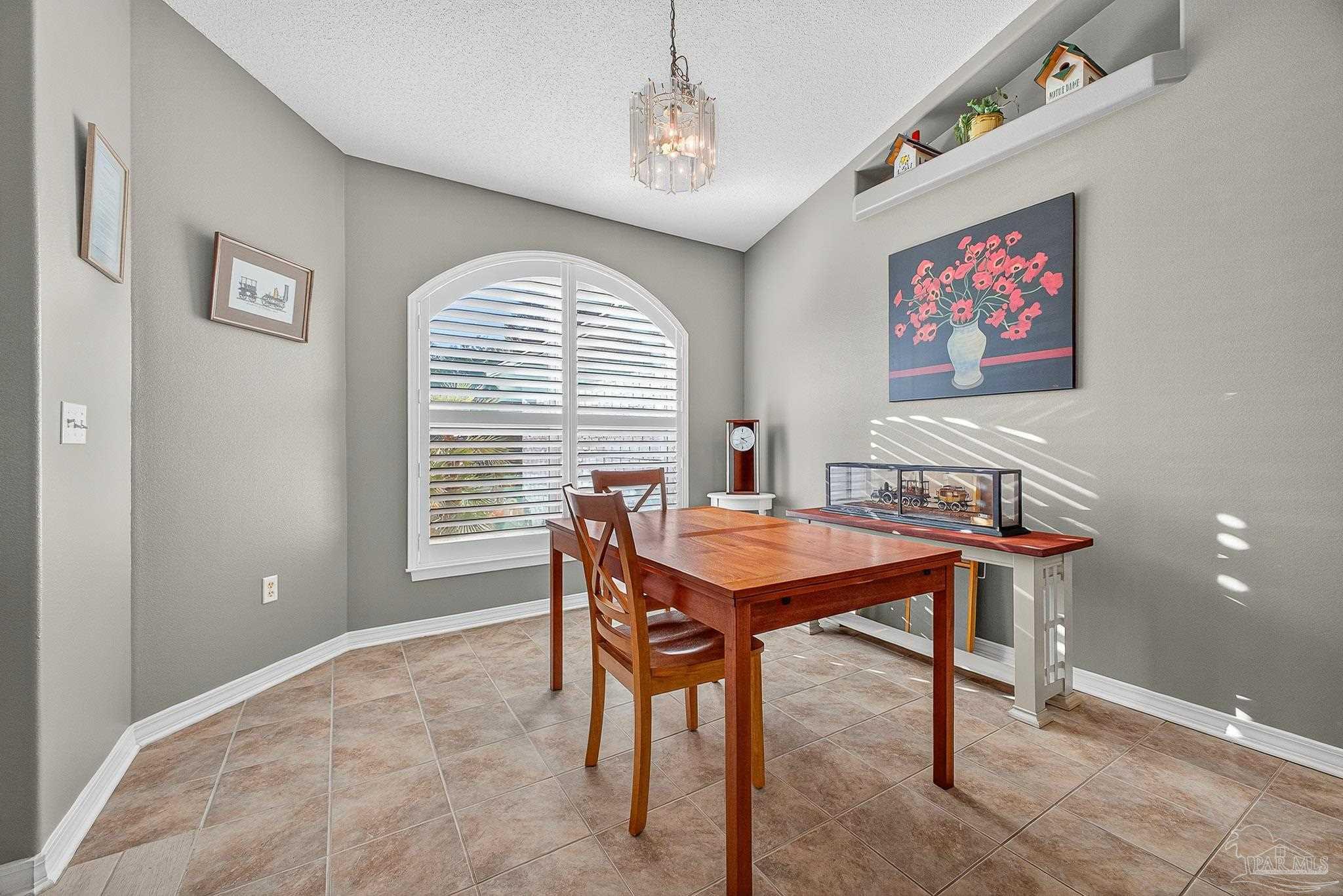 4650 Ridge Pointe Drive Pace, FL 32571 - Photo 7 of 38 a dining room with furniture and window