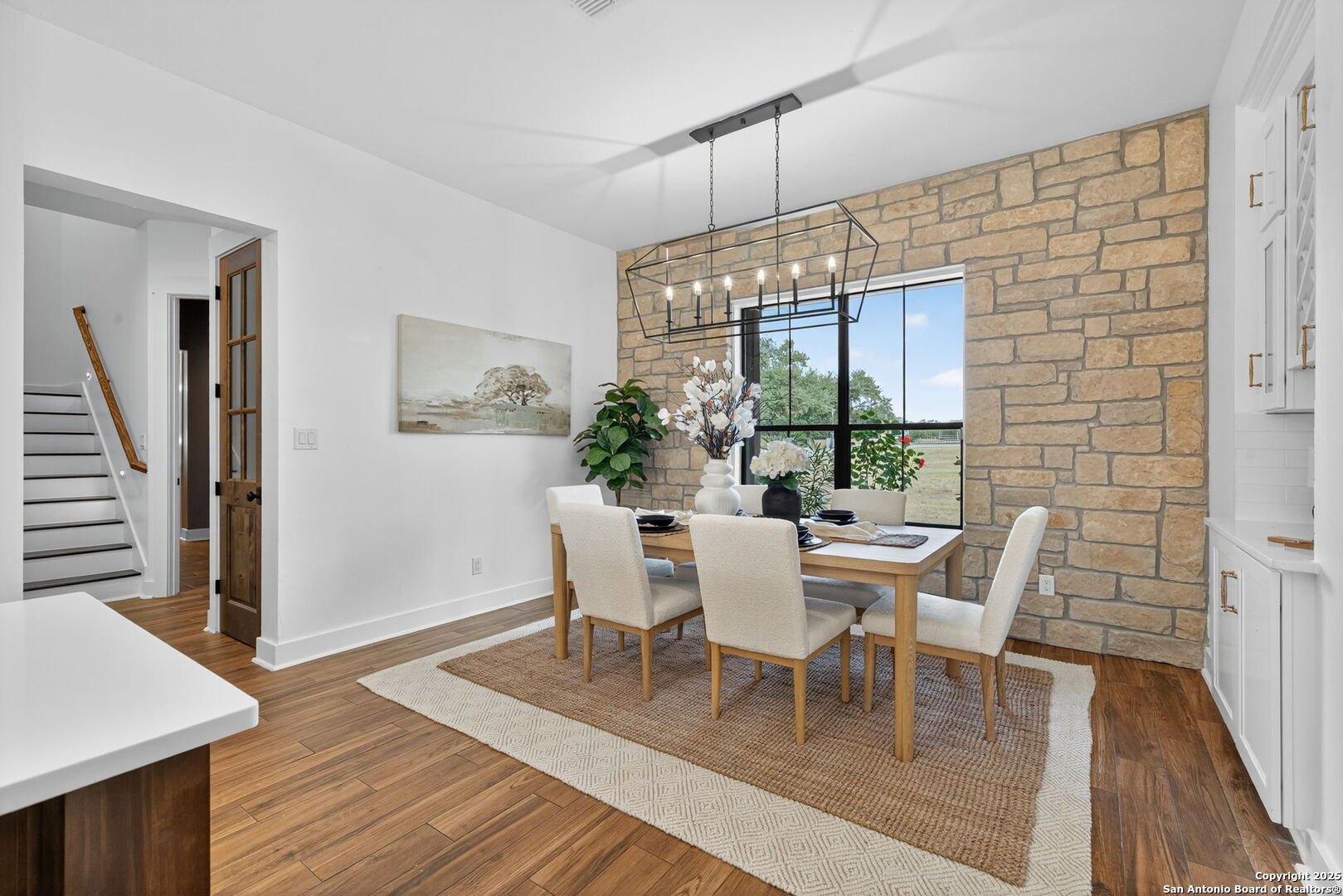 1115 Meadow Stone Court Spring Branch, TX 78070 - Photo 13 of 42 a dining room with furniture window and wooden floor
