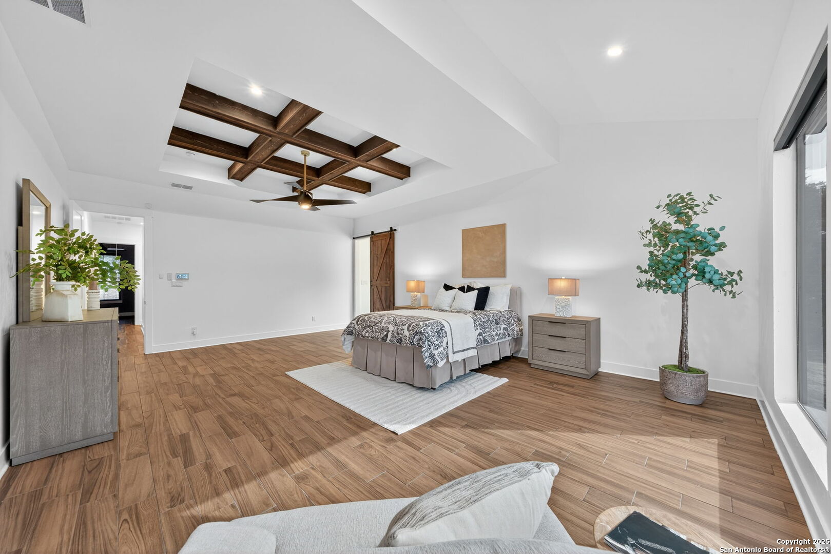 1115 Meadow Stone Court Spring Branch, TX 78070 - Photo 16 of 42 a bedroom with furniture and a potted plant