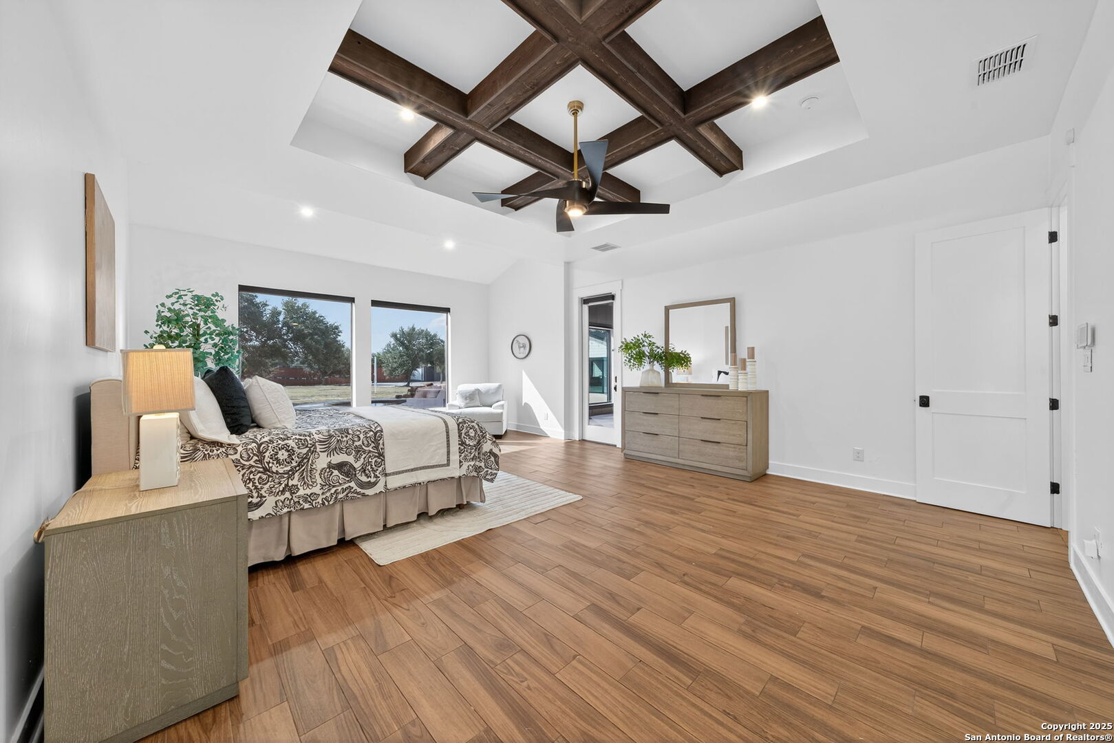 1115 Meadow Stone Court Spring Branch, TX 78070 - Photo 17 of 42 a living room with furniture and a wooden floor