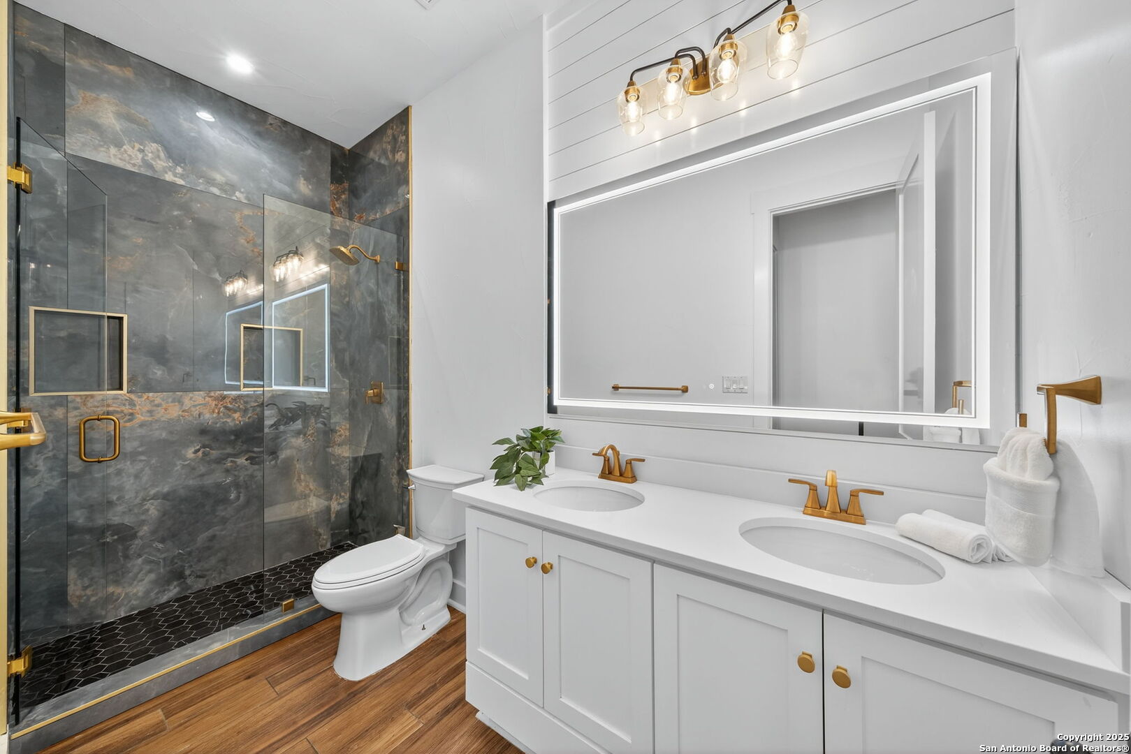 1115 Meadow Stone Court Spring Branch, TX 78070 - Photo 21 of 42 a bathroom with a sink a toilet and shower