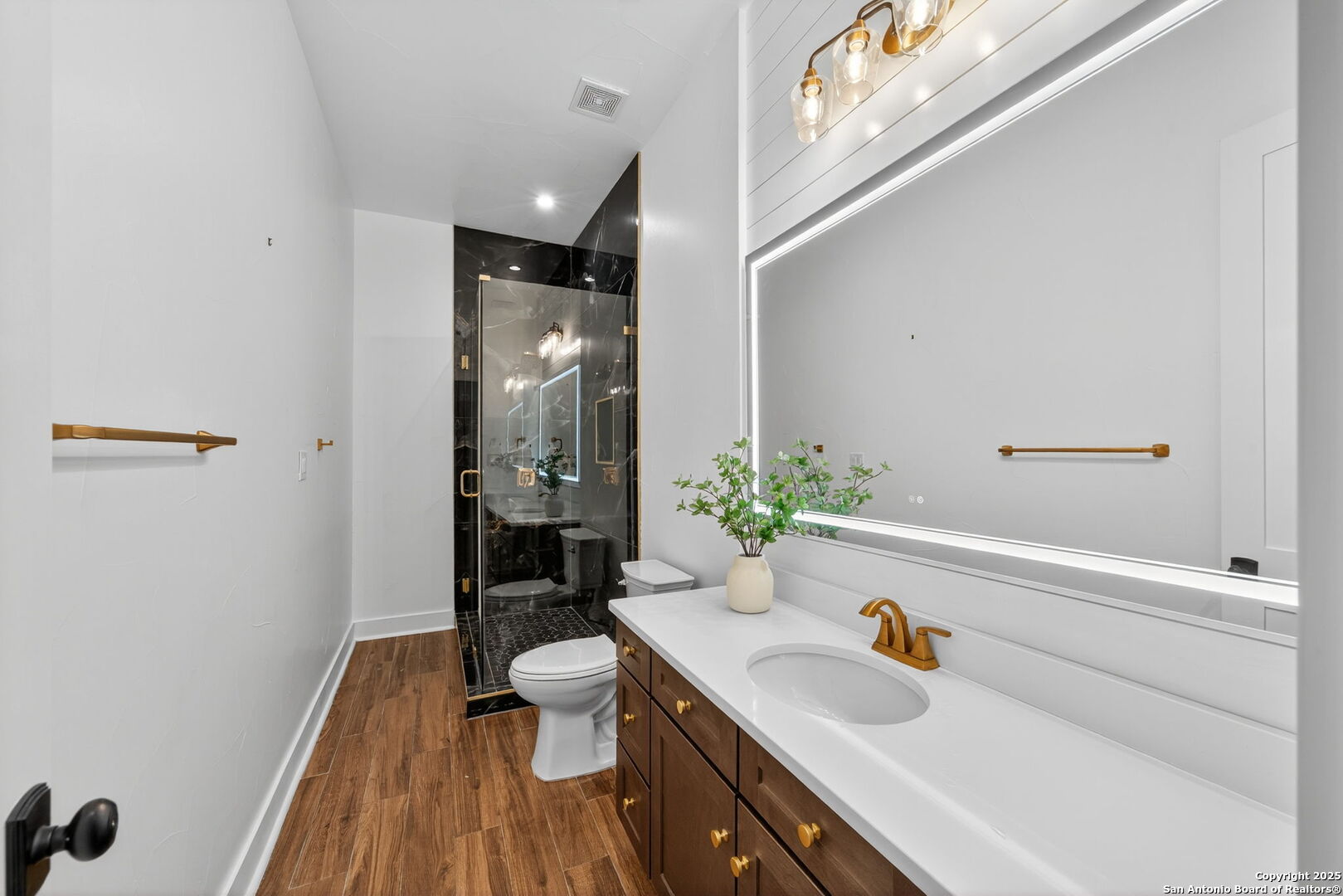 1115 Meadow Stone Court Spring Branch, TX 78070 - Photo 27 of 42 a bathroom with a sink a toilet and shower