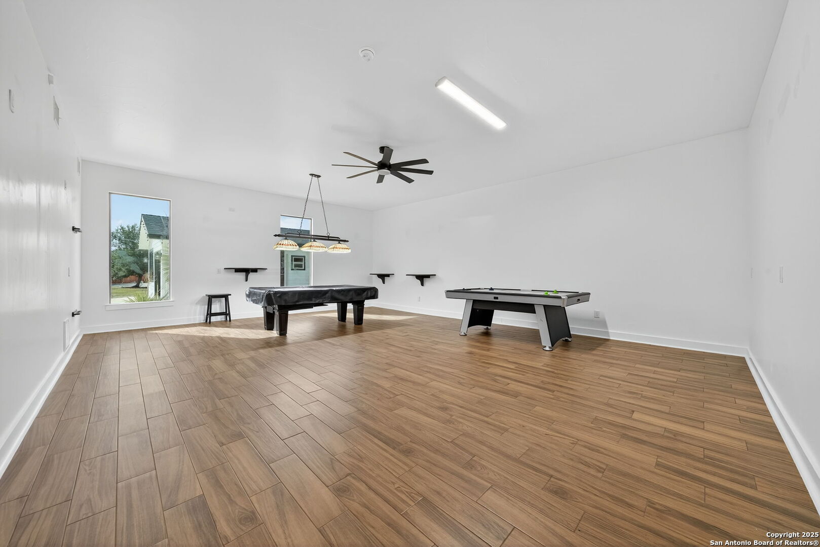 1115 Meadow Stone Court Spring Branch, TX 78070 - Photo 29 of 42 a living room with furniture and a wooden floor