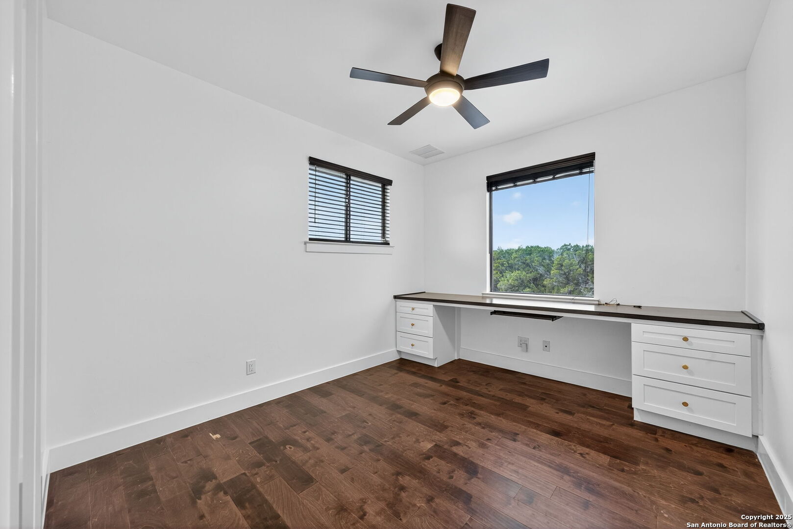 1115 Meadow Stone Court Spring Branch, TX 78070 - Photo 30 of 42 an empty room with windows and fan
