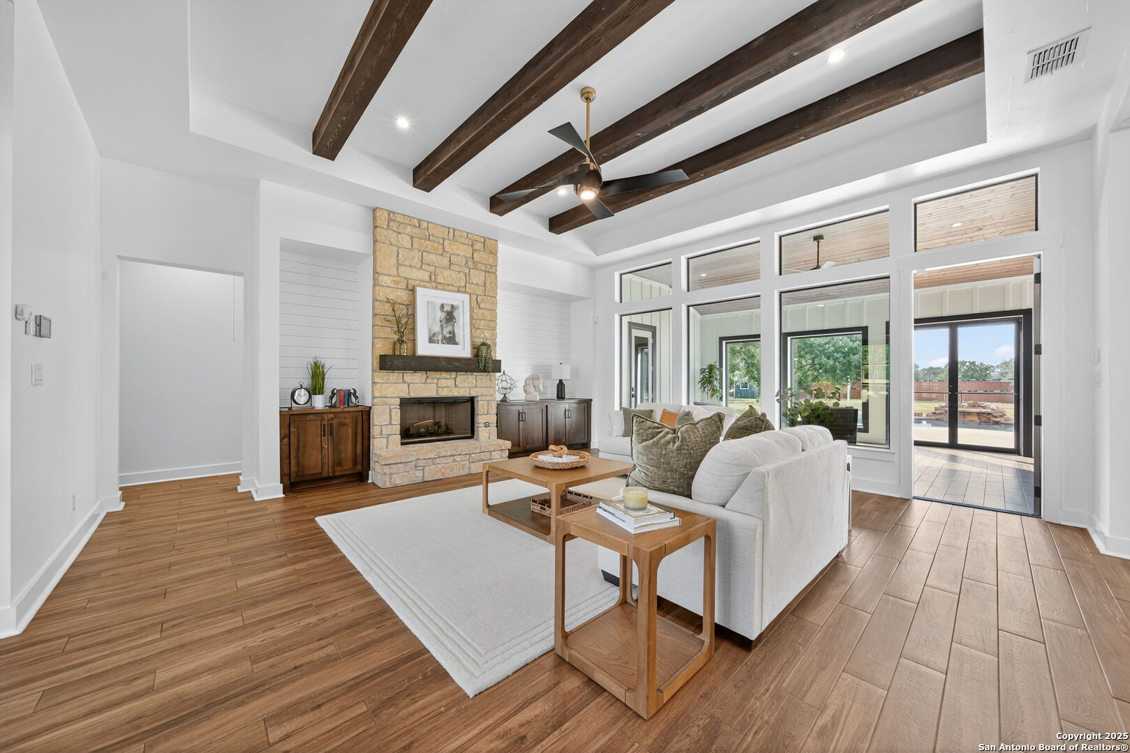 1115 Meadow Stone Court Spring Branch, TX 78070 - Photo 3 of 42 a living room with furniture and a fireplace