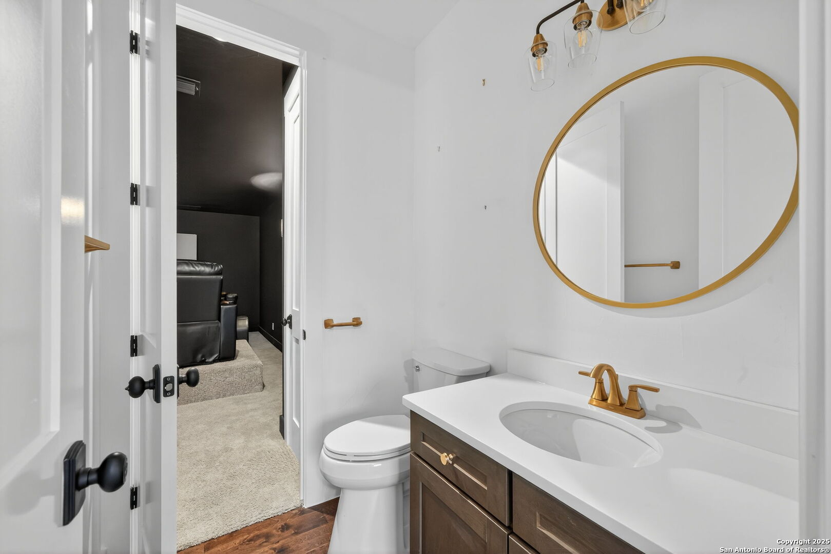1115 Meadow Stone Court Spring Branch, TX 78070 - Photo 31 of 42 a bathroom with a sink a toilet and a mirror