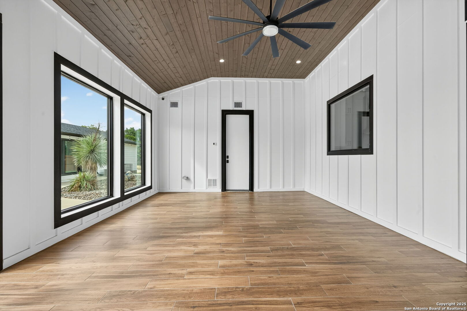1115 Meadow Stone Court Spring Branch, TX 78070 - Photo 34 of 42 a view of an empty room with window and wooden floor