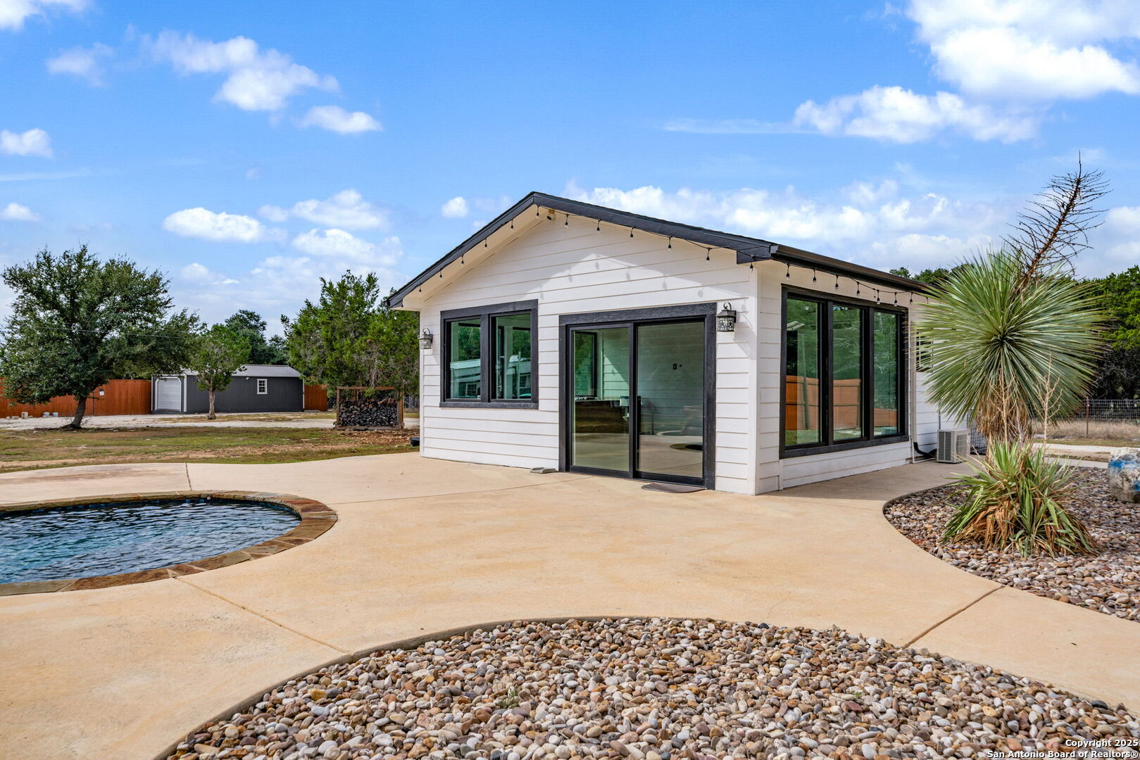 1115 Meadow Stone Court Spring Branch, TX 78070 - Photo 35 of 42 a front view of house with yard outdoor seating and barbeque oven